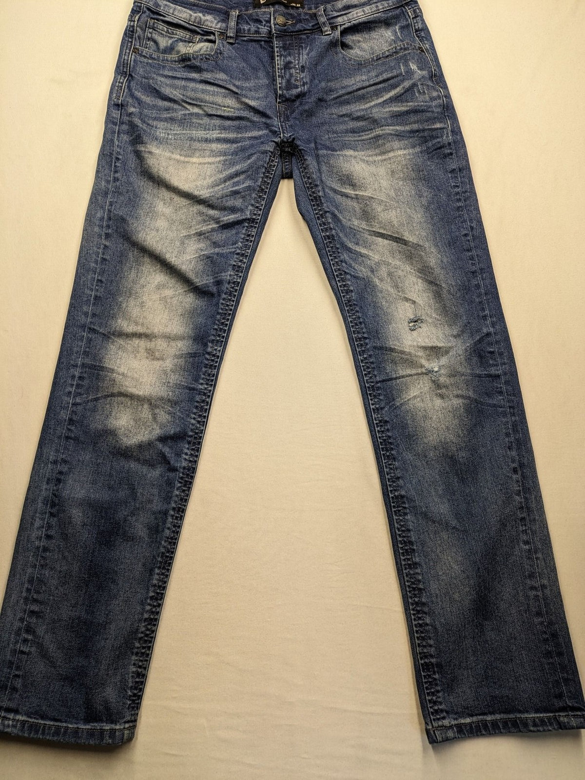 Brandit blue straight jeans with distressed details, button fly, and classic 5-pocket style.
