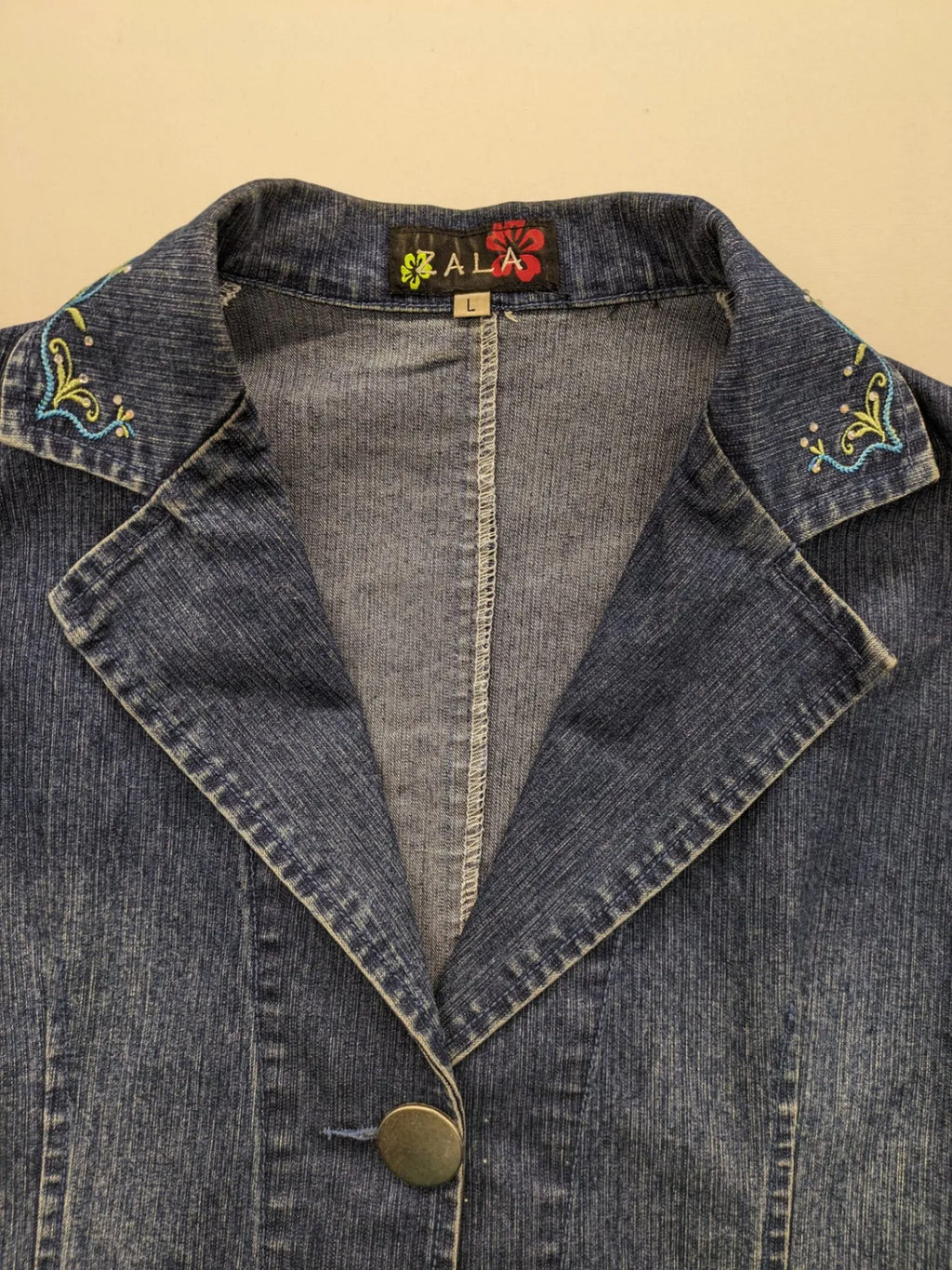 Zala blue denim blazer jacket with embroidered details and classic button closure.