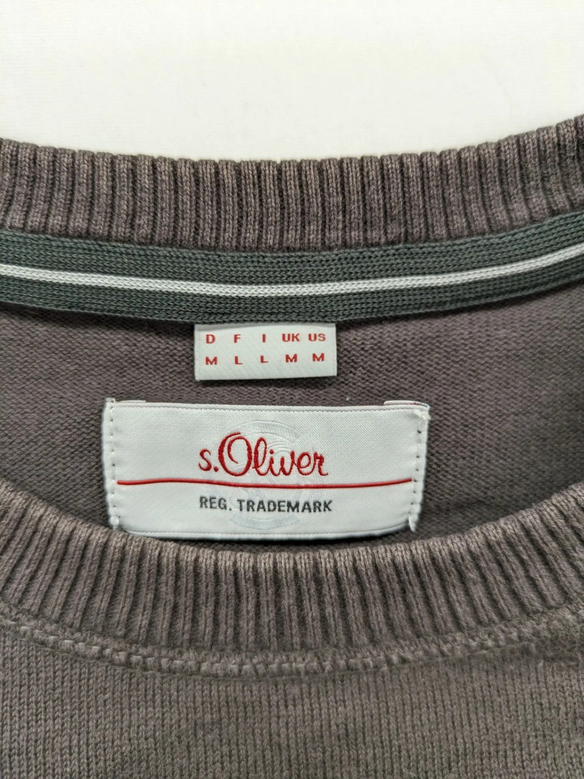 s.Oliver brown turtle neck jumper with "Radford Inc." graphic print and ribbed cuffs.