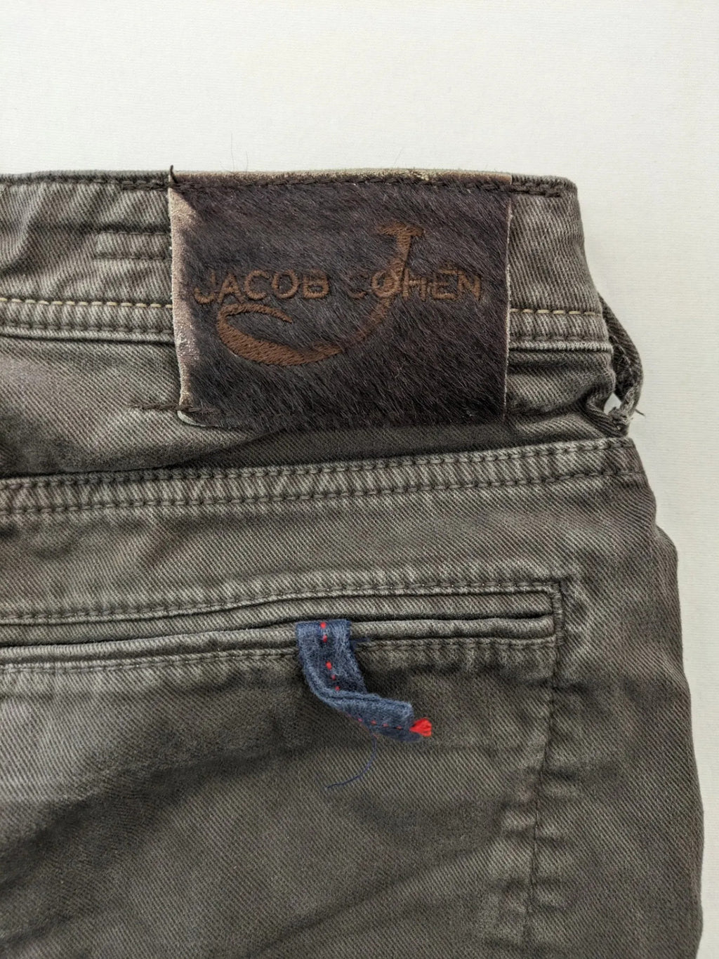 Jacob Cohen black straight jeans with leather logo patch and zip fly, size 32.