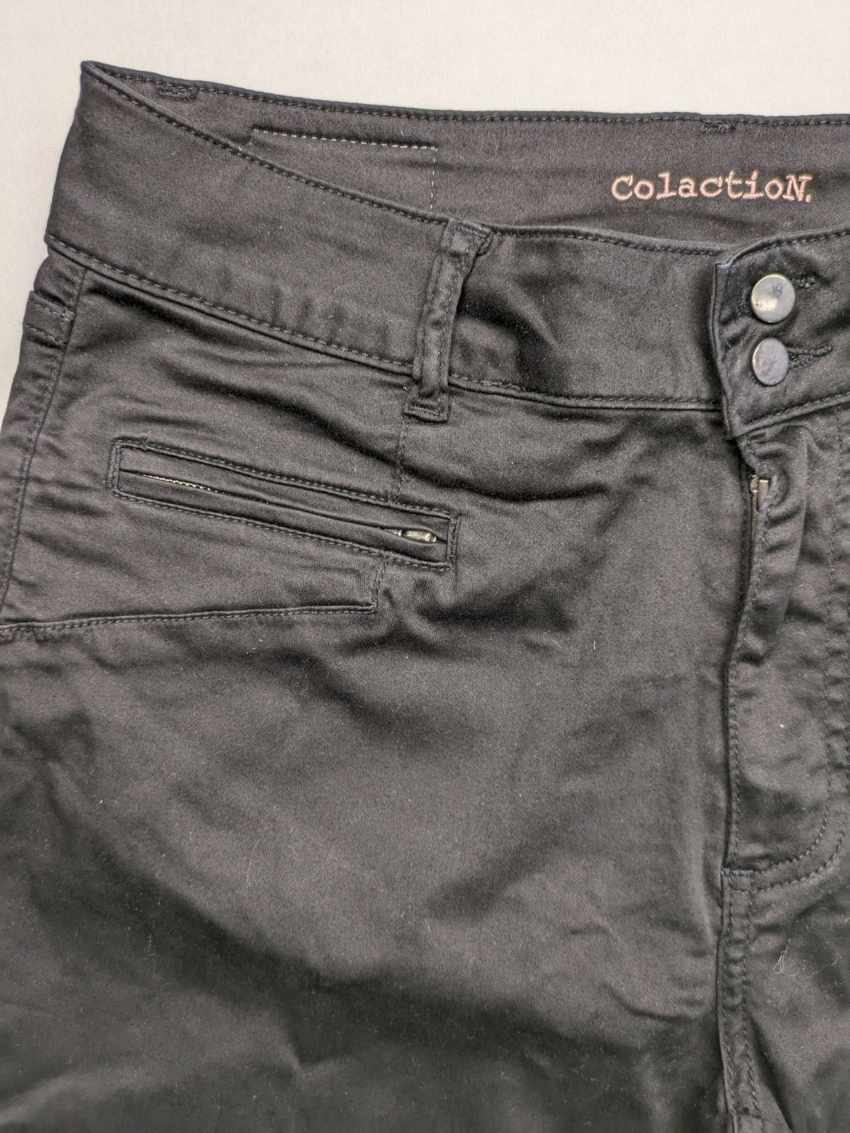 Colac black straight jeans high waist with double button, zipper pockets, and stretch material.
