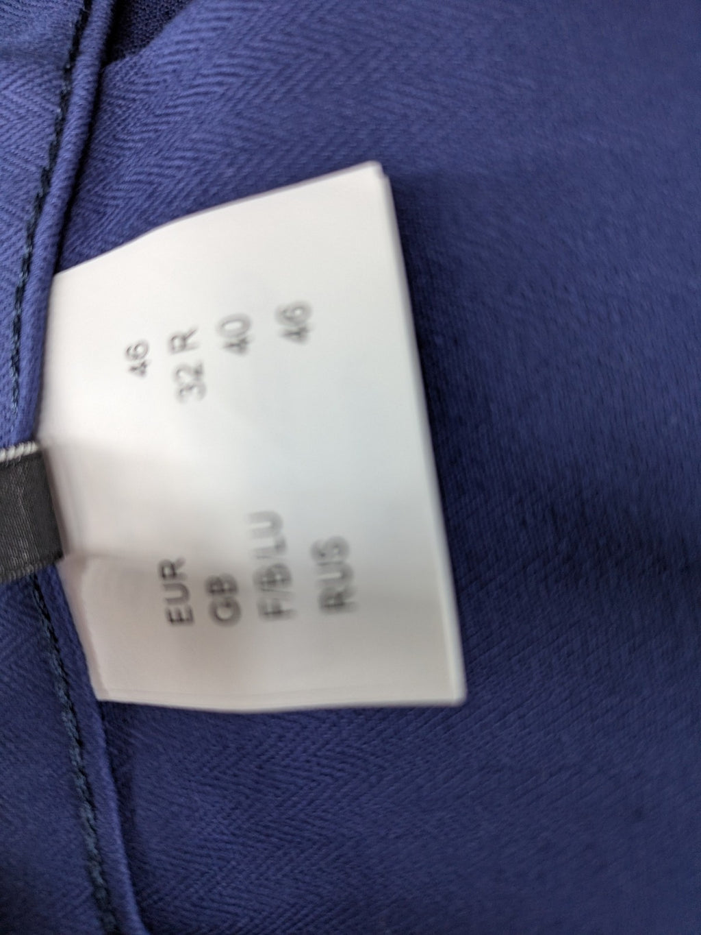 Uvex navy work trousers 100% cotton with button closure and belt loops.