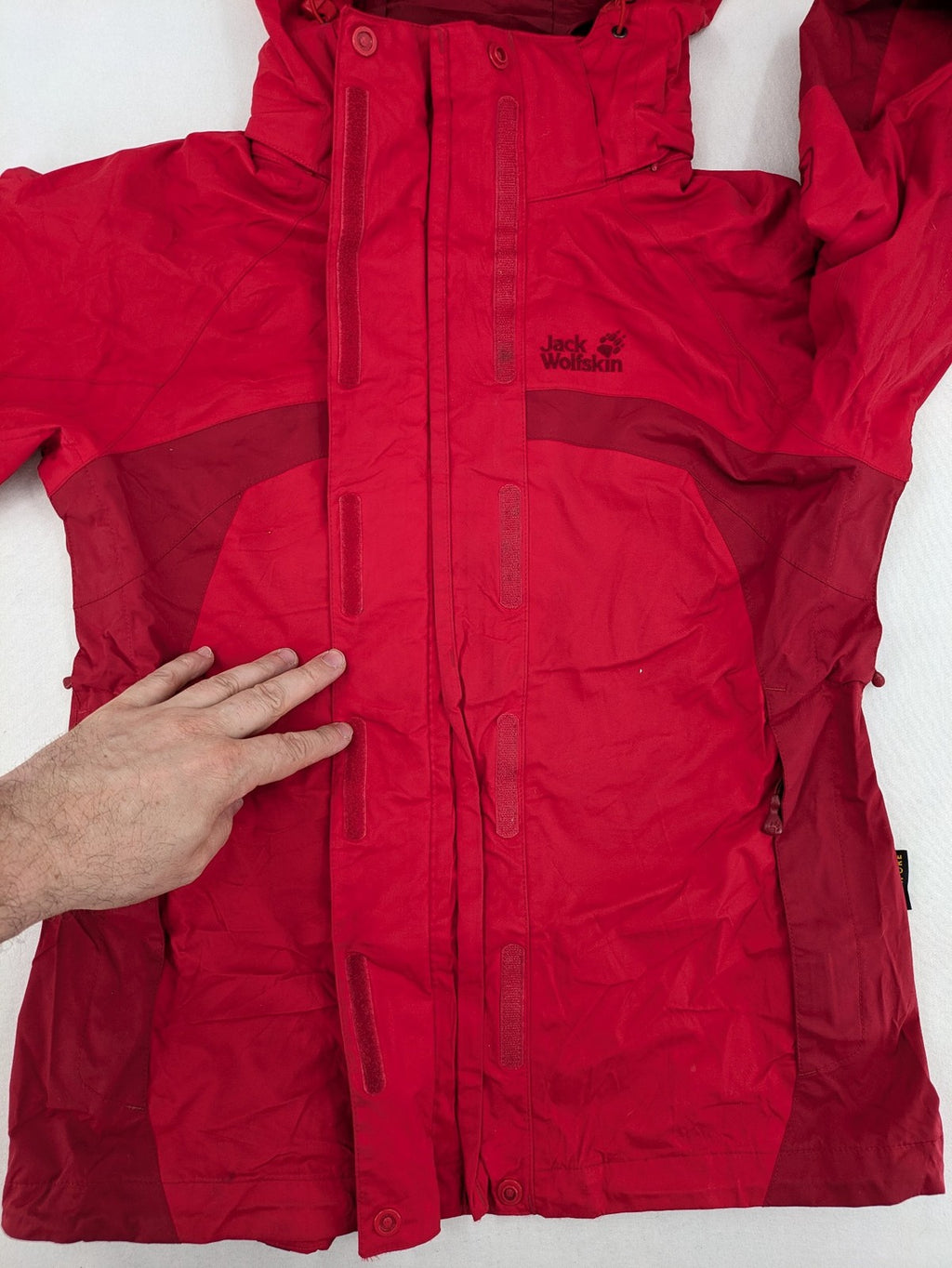 Jack Wolfskin red outdoor jacket with adjustable hood and Texapore waterproof technology