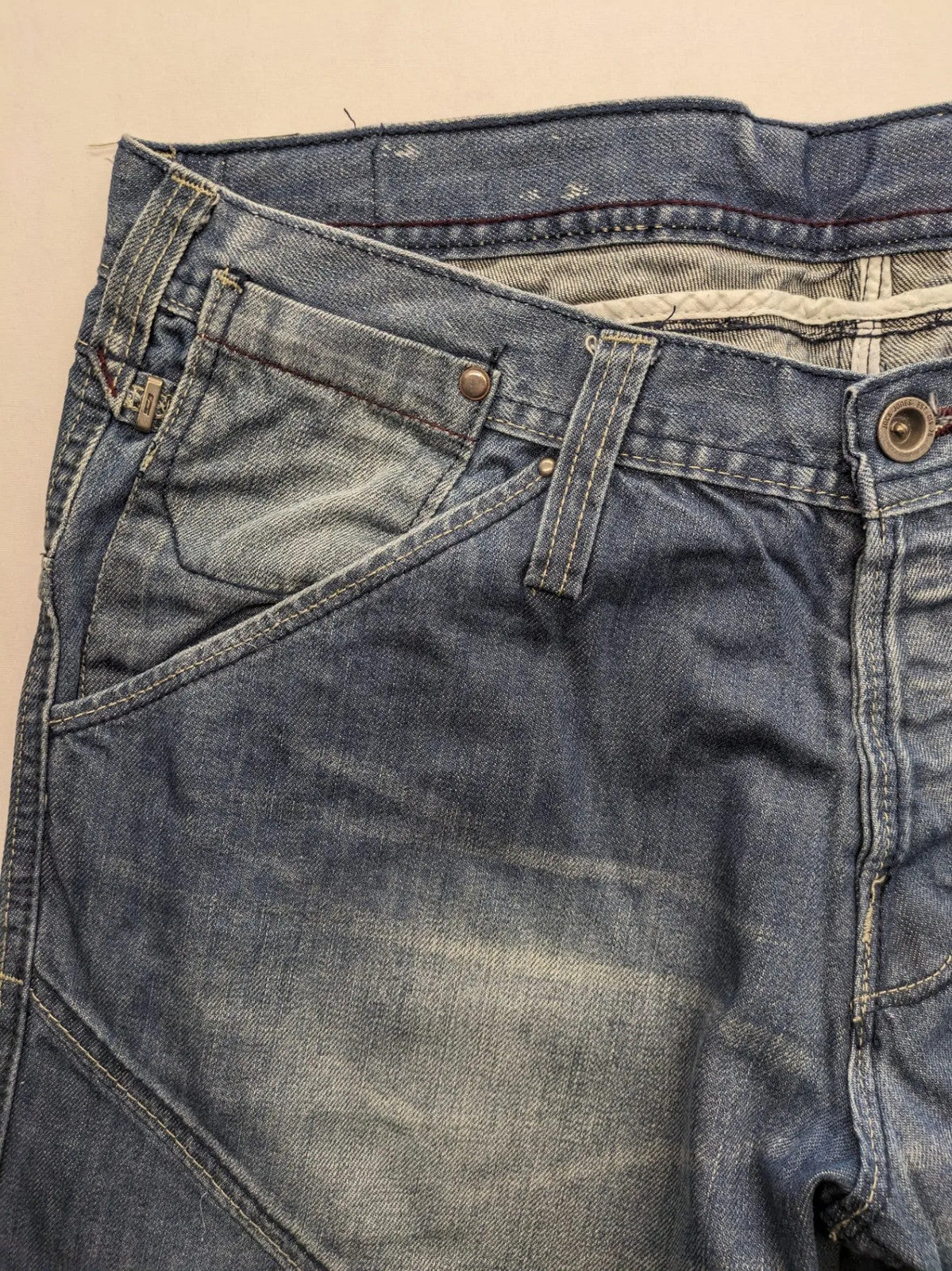 Jack & Jones blue straight jeans with biker panel details and button-fly closure.