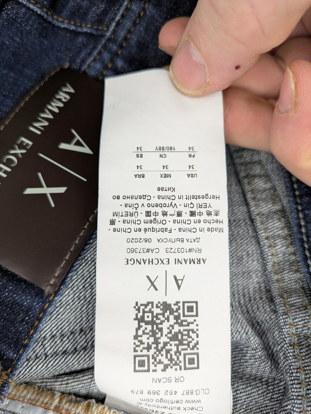Armani Exchange blue slim fit jeans with distressed details and classic 5-pocket design.