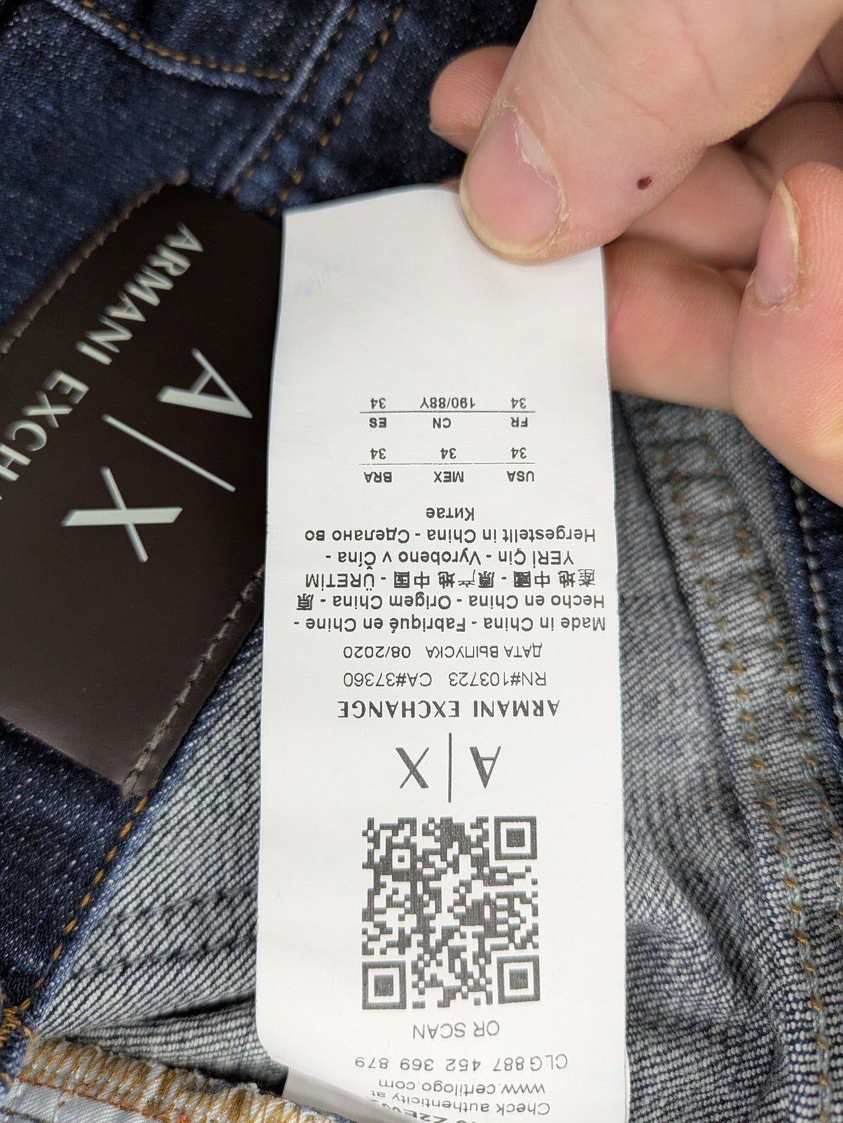 Armani Exchange blue slim fit jeans with distressed details and classic 5-pocket design.