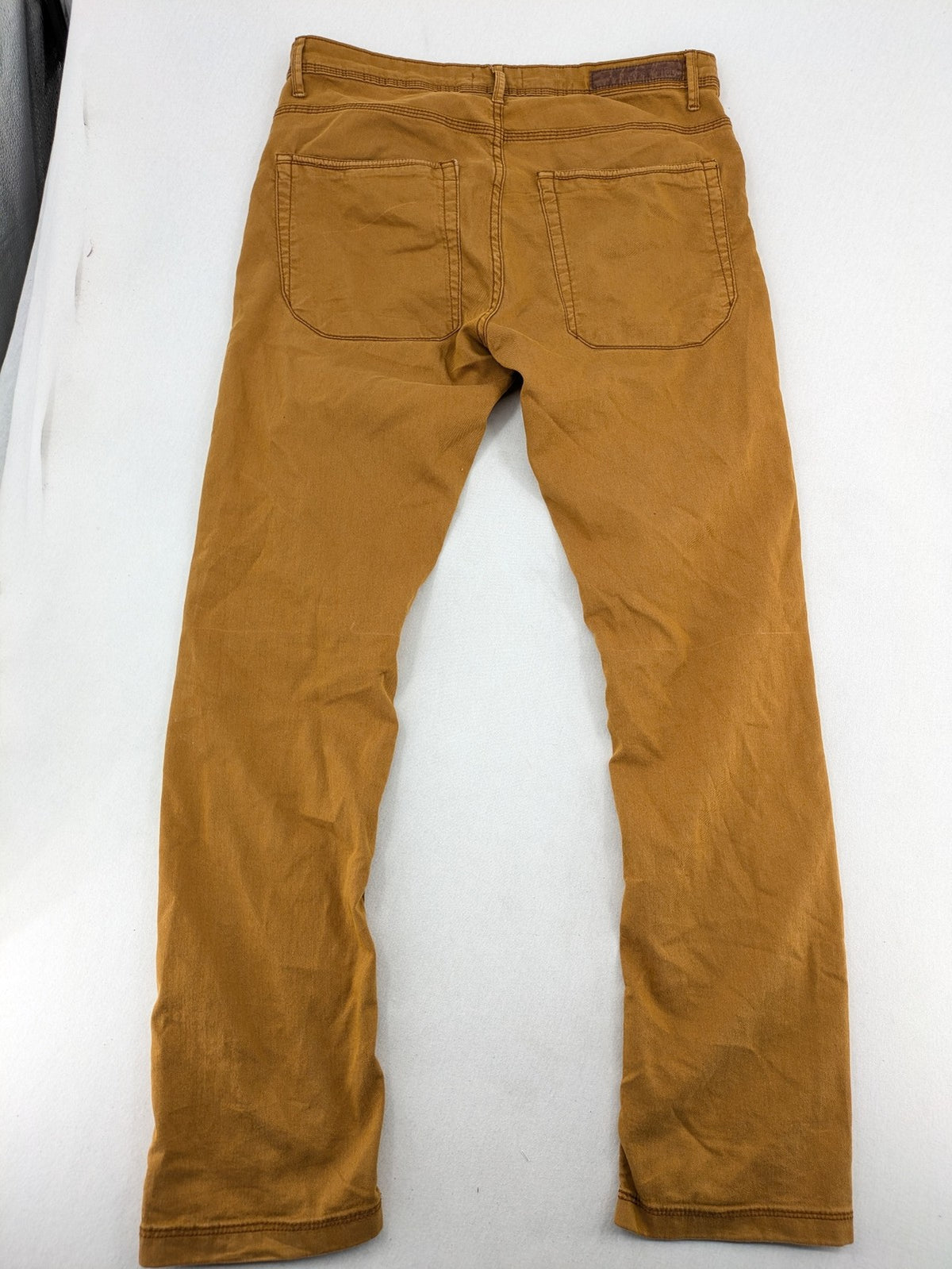 Bershka brown straight jeans slim fit classic 5-pocket design with prominent stitching.