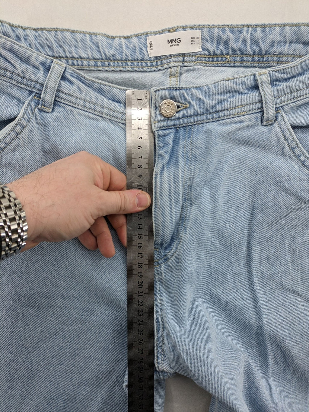 MNG blue straight jeans with cargo pockets and raw hem, high waist denim.