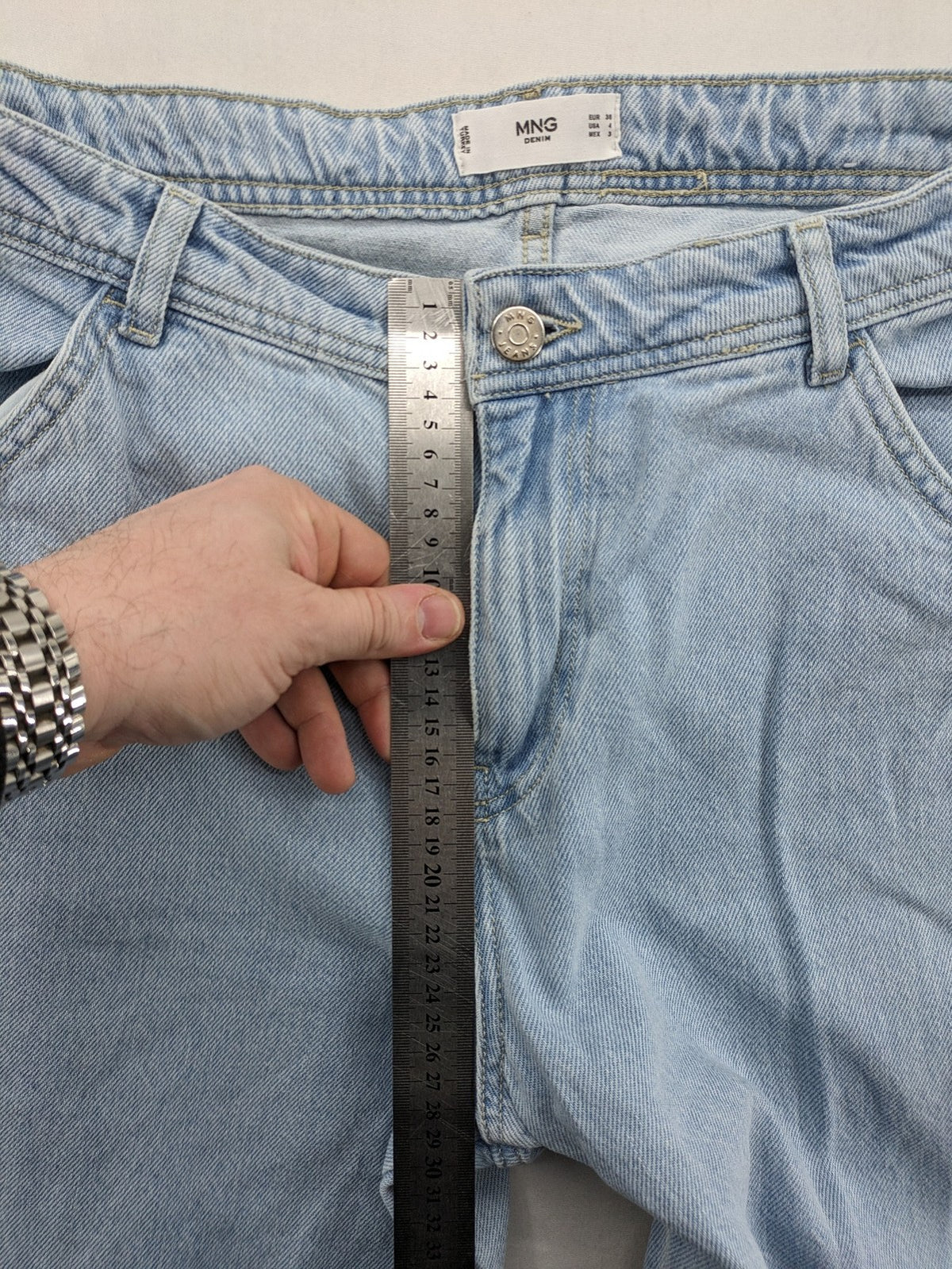 MNG blue straight jeans with cargo pockets and raw hem, high waist denim.