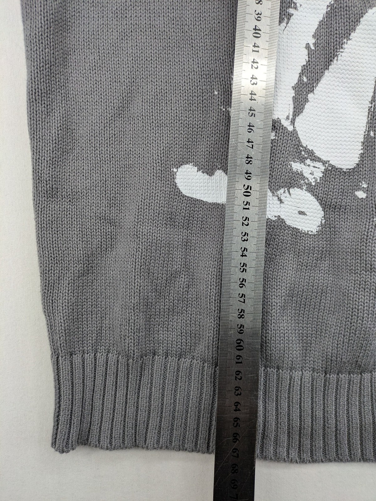 MOREMONEY grey turtle neck jumper with white abstract graphic print and relaxed fit.