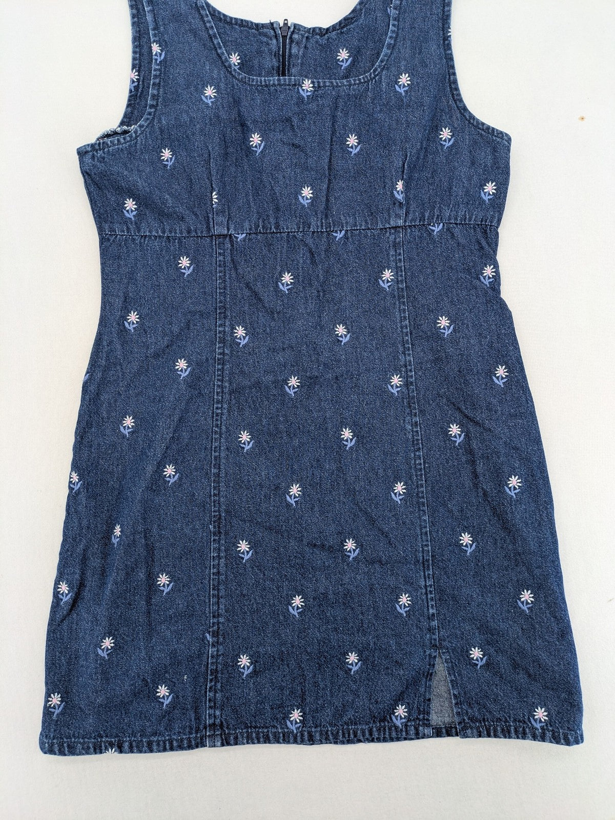Damen blue denim mini dress with all-over white and light blue floral embroidery.