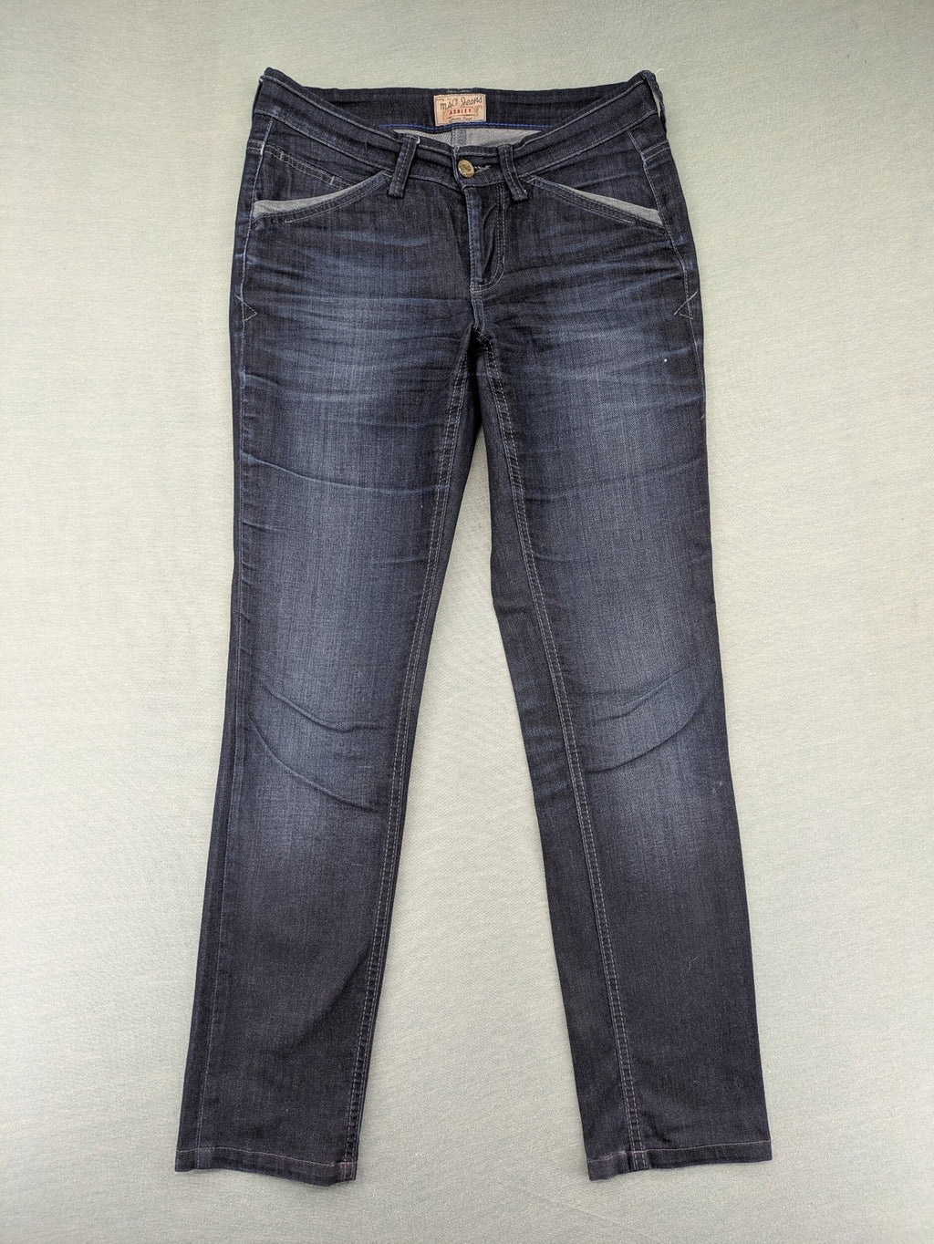 Mac Jeans blue straight jeans dark wash with subtle fading and stretch denim material.