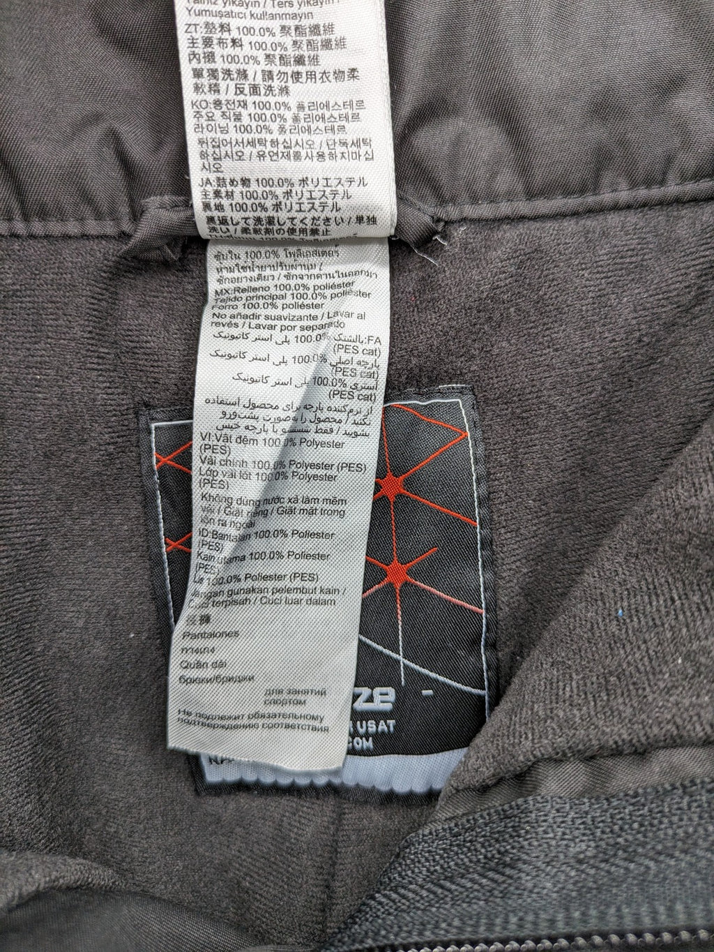 Wed'ze black ski pants with adjustable waistband, zip pockets, and Pull'n'Fit system.