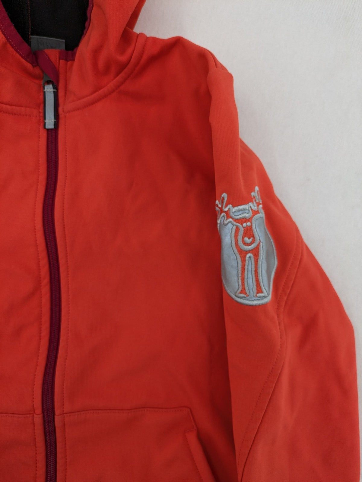 elkline orange softshell coat with fleece lining and elk logo patch