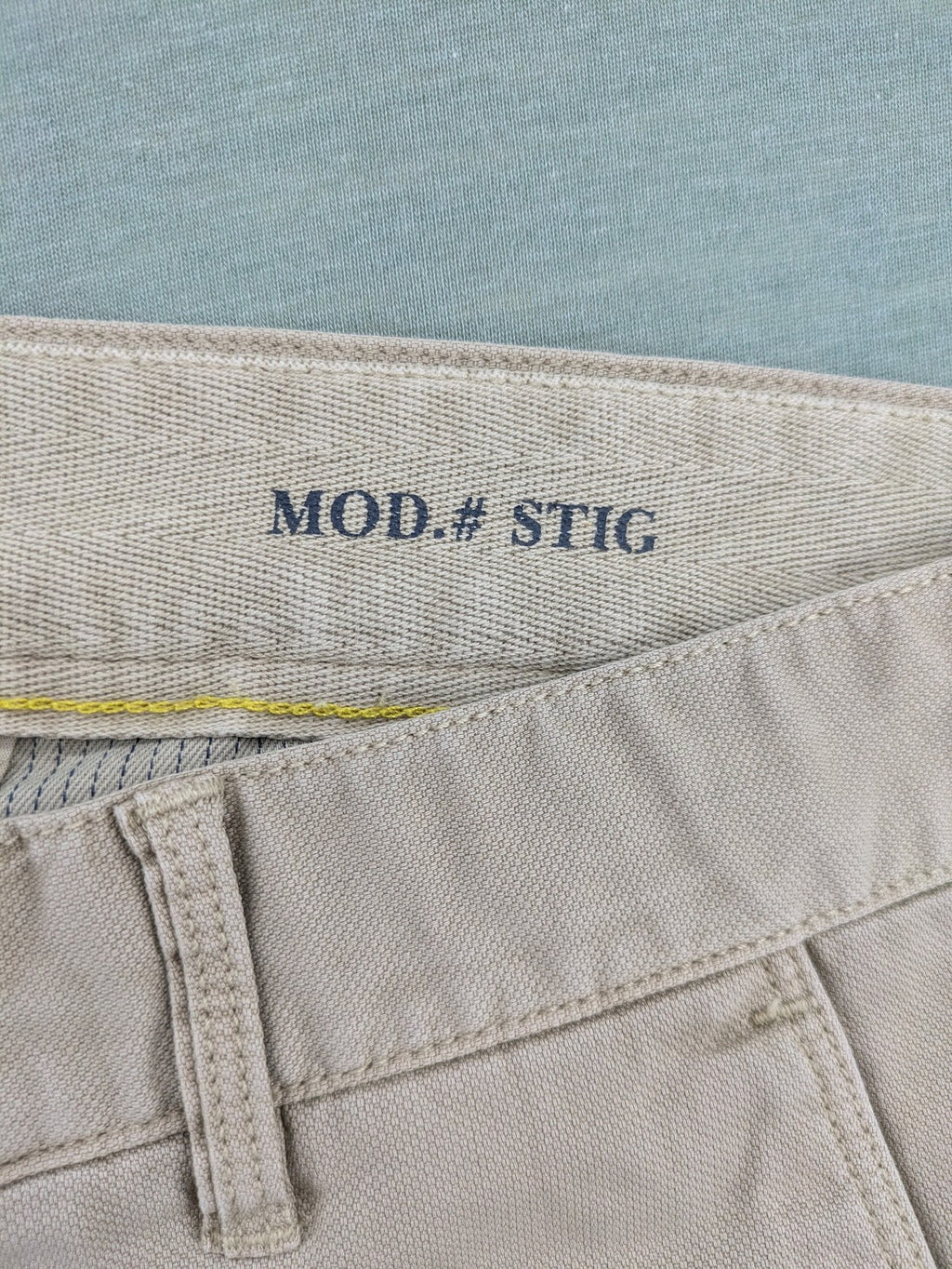 Marc O'Polo beige tapered fit chino pants, soft cotton stretch fabric, modern silhouette.