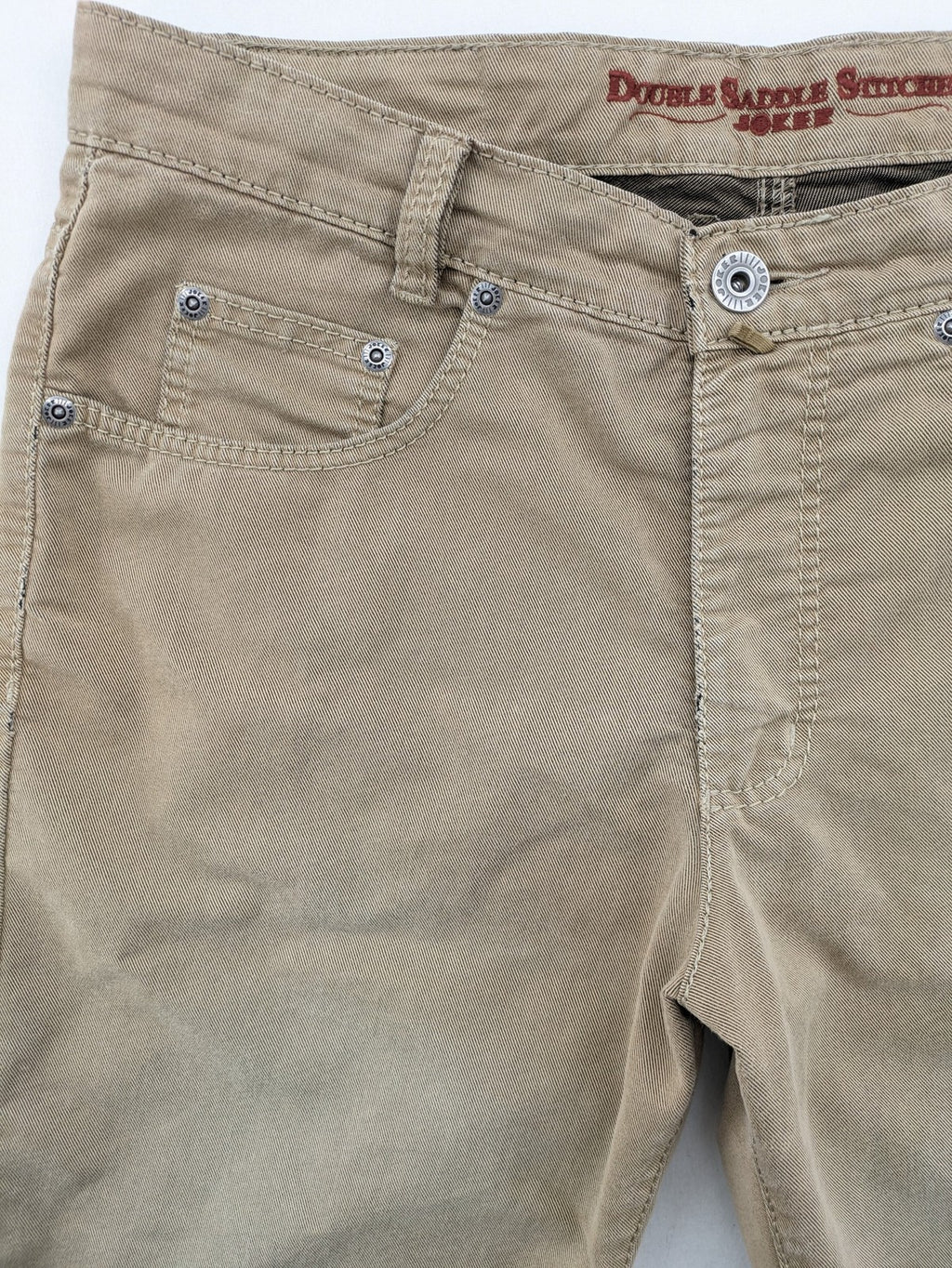Joker beige straight jeans with double saddle stitching and classic 5-pocket design.