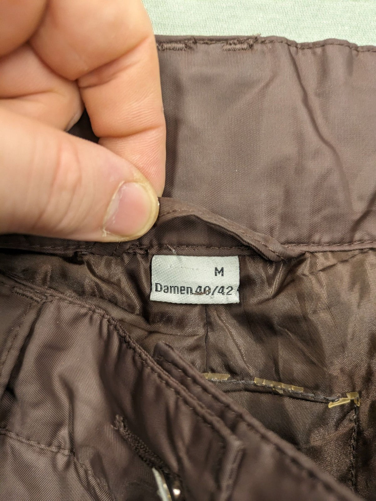 Thinsulate black and blue ski jumpsuit with hood and zippered pockets.