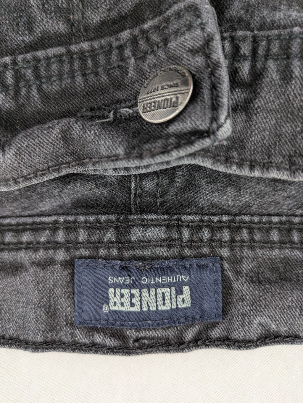Pioneer grey straight jeans with washed finish and stretch material, classic design.