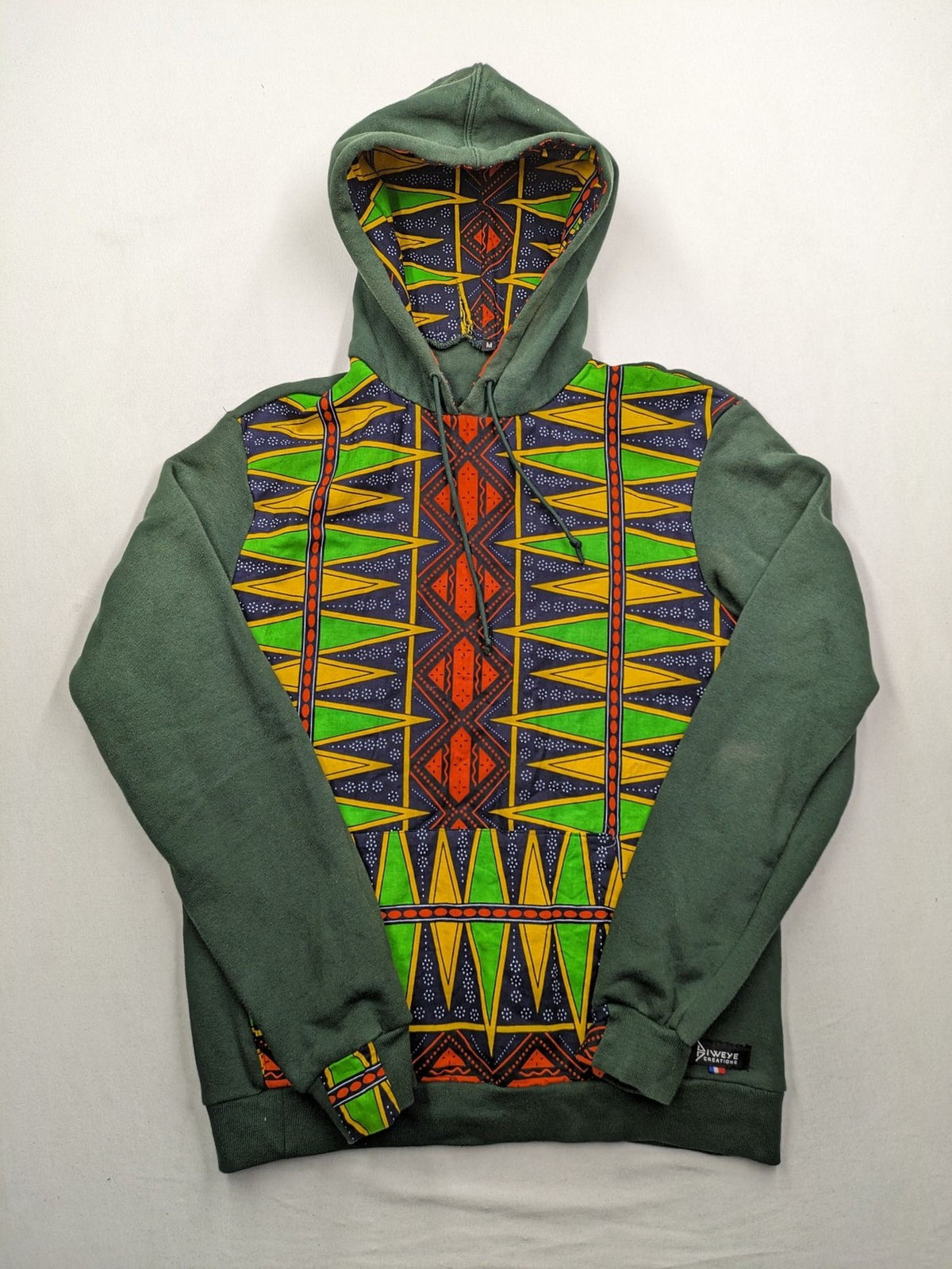 Diweye Creations multi turtle neck jumper with vibrant African print and soft green material.