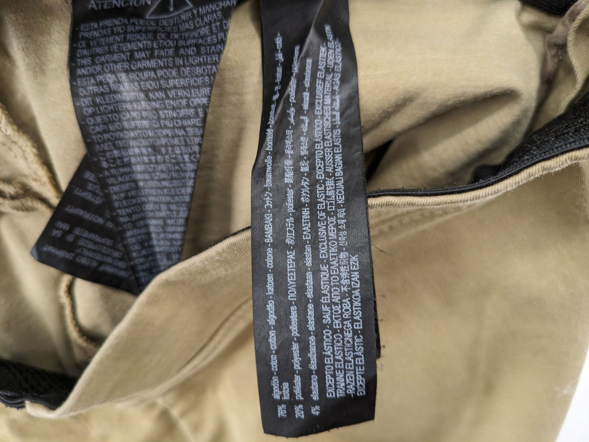 Zara khaki pants with elastic waistband, made from stretch cotton blend for comfort.