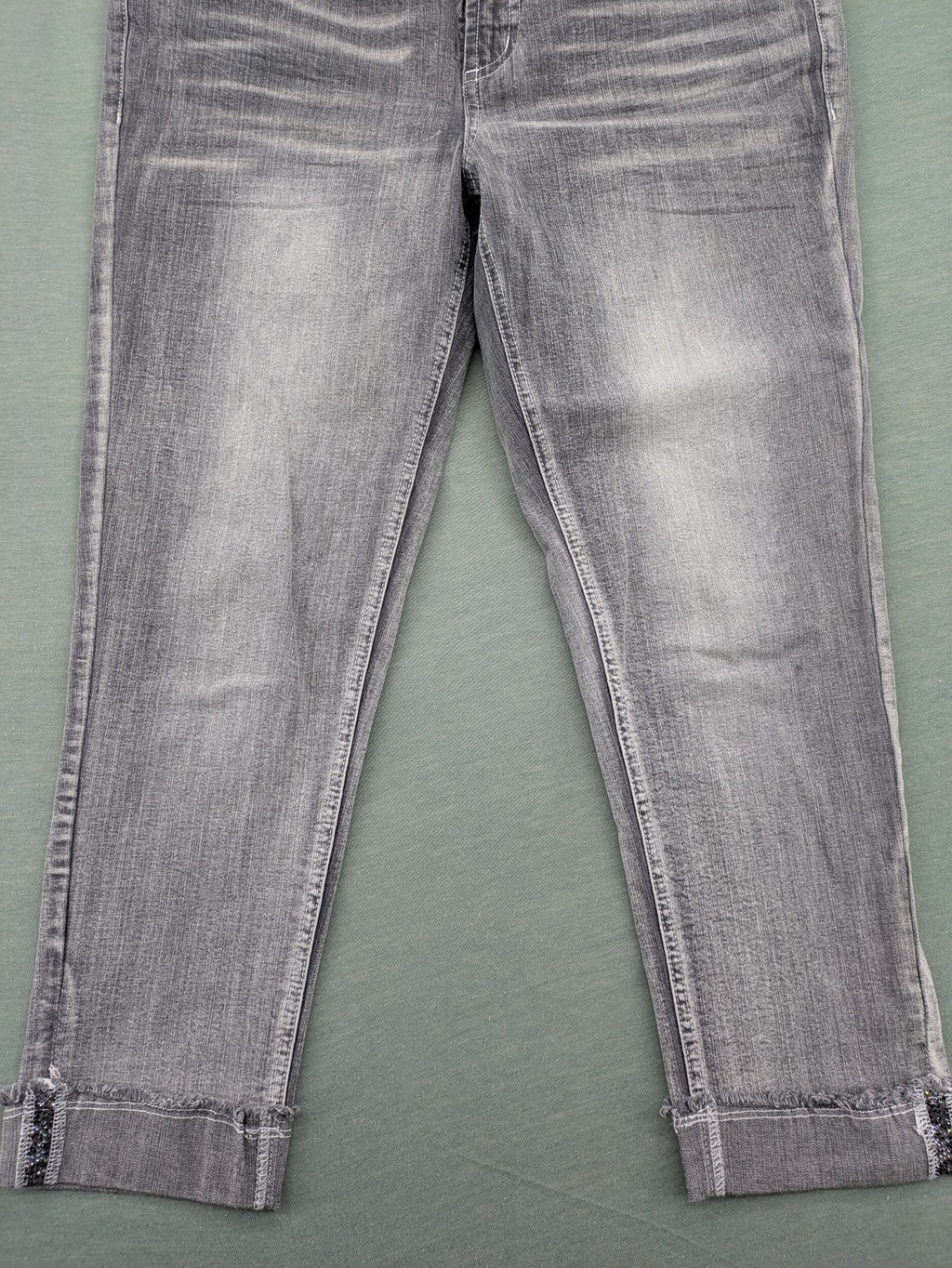 Rick Cardona grey cropped straight jeans with frayed hems and sparkling rhinestone details.