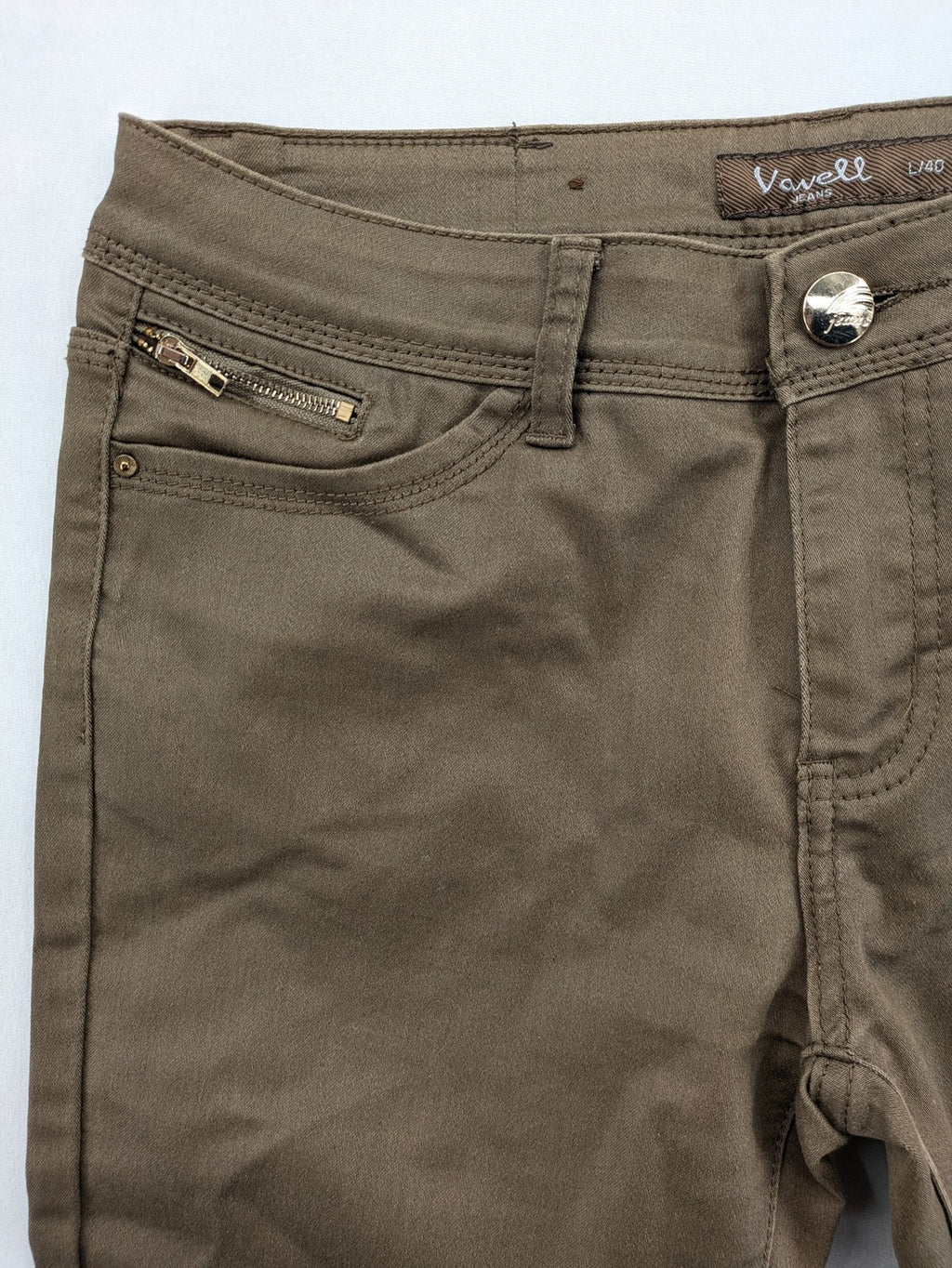 Vavell khaki skinny jeans five-pocket design with unique front zipper detail.