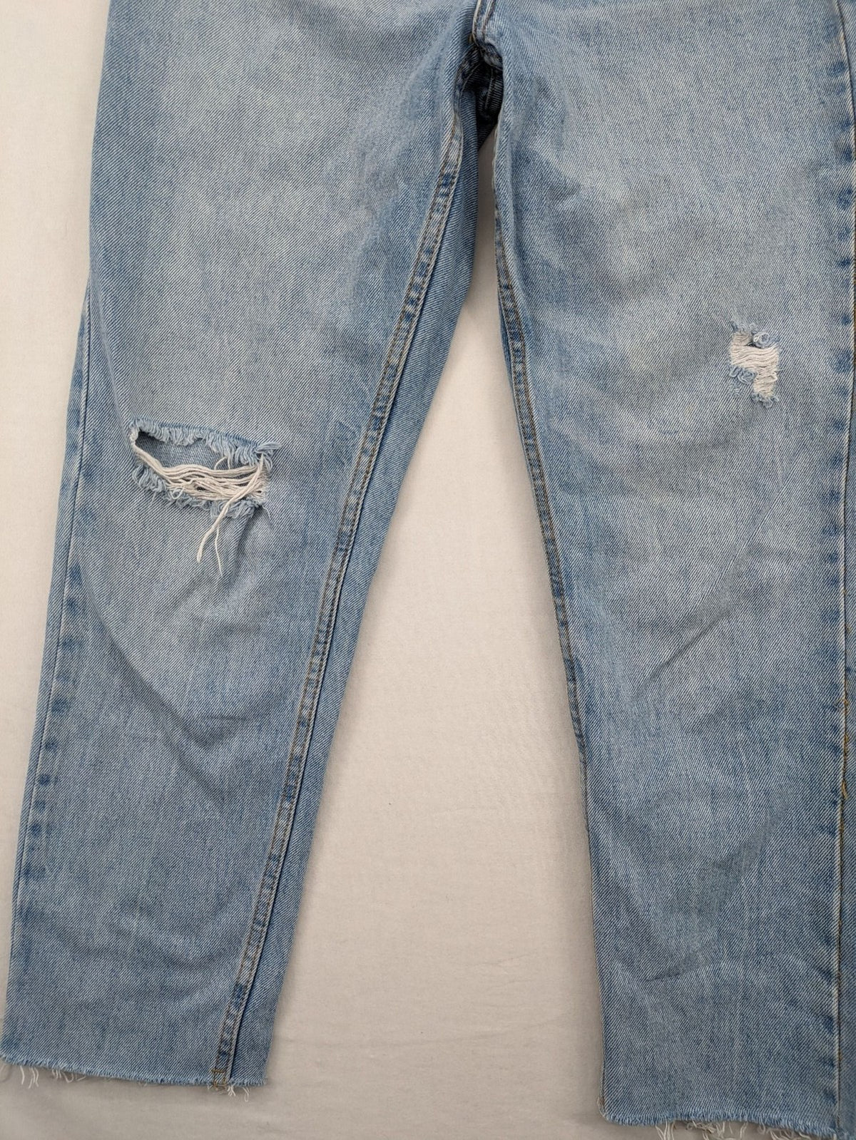 FB Sister blue straight leg jeans high rise with distressed detailing and button fly.