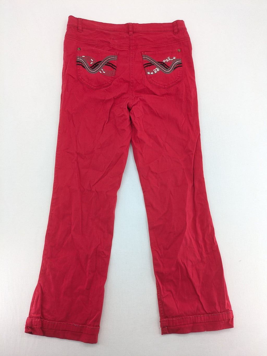 Jet Line red bootcut jeans with embroidered back pockets and pearl embellishments.