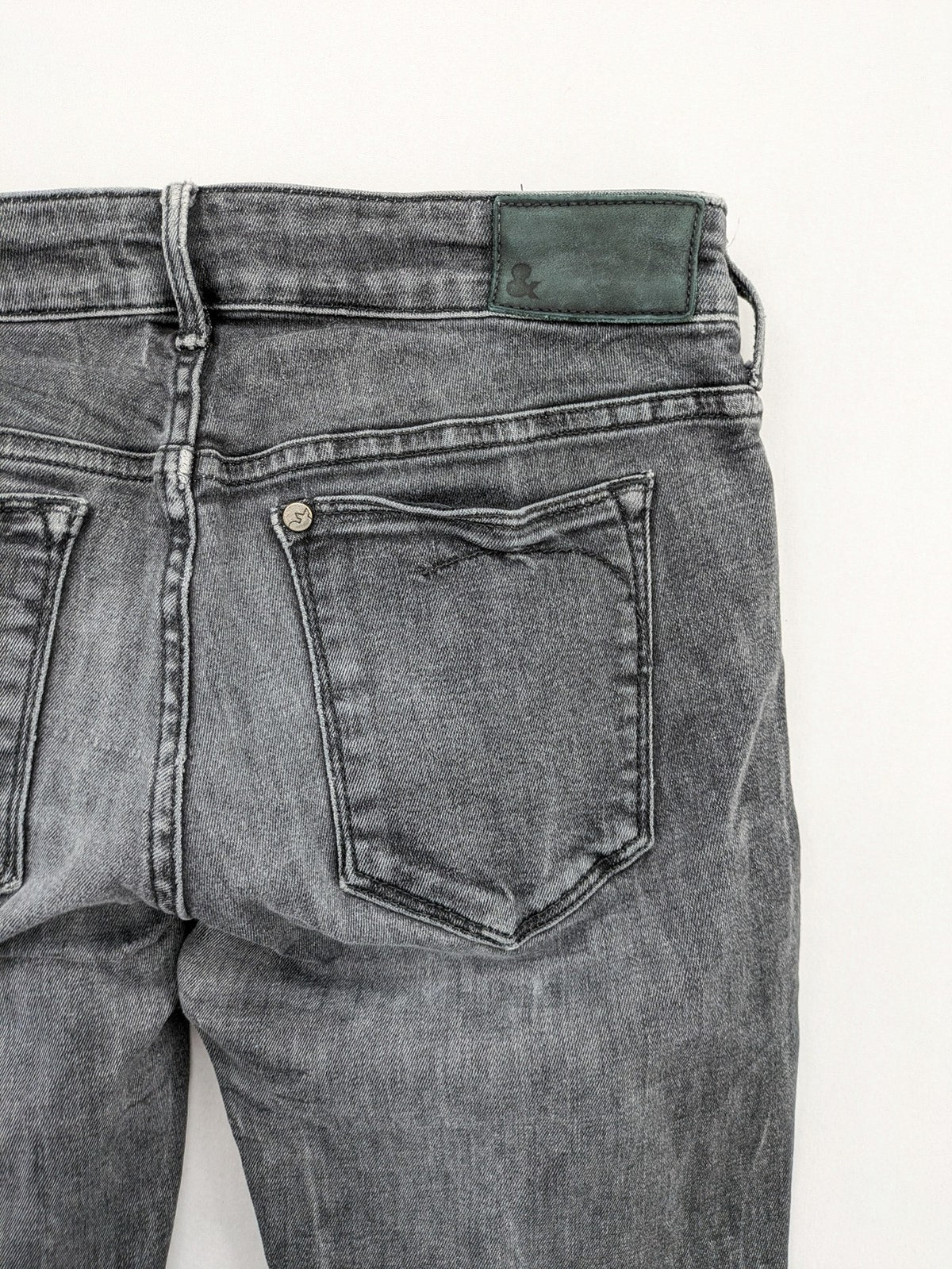 H&M grey skinny jeans with low rise, classic 5-pocket style, and washed denim finish.
