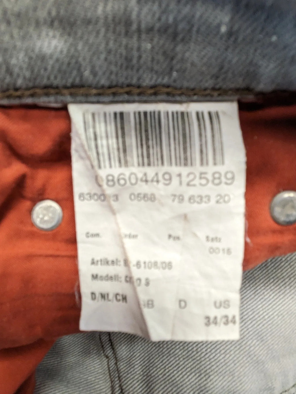 BRAX grey straight jeans with classic 5-pocket style and washed denim finish.