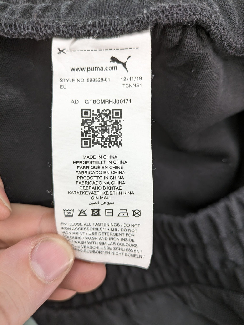 Puma grey sweatshorts featuring Mercedes AMG Petronas logo and elastic waistband.