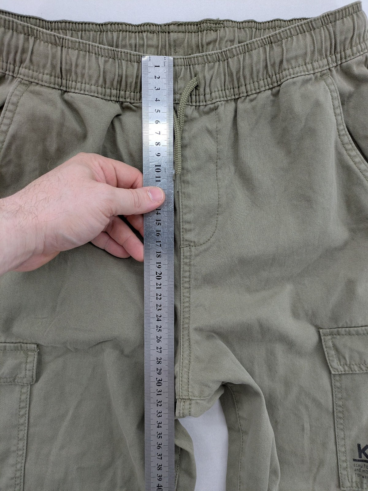 Y.F.K. khaki cargo pants with elastic cuffs, side pockets, and drawstring waistband.