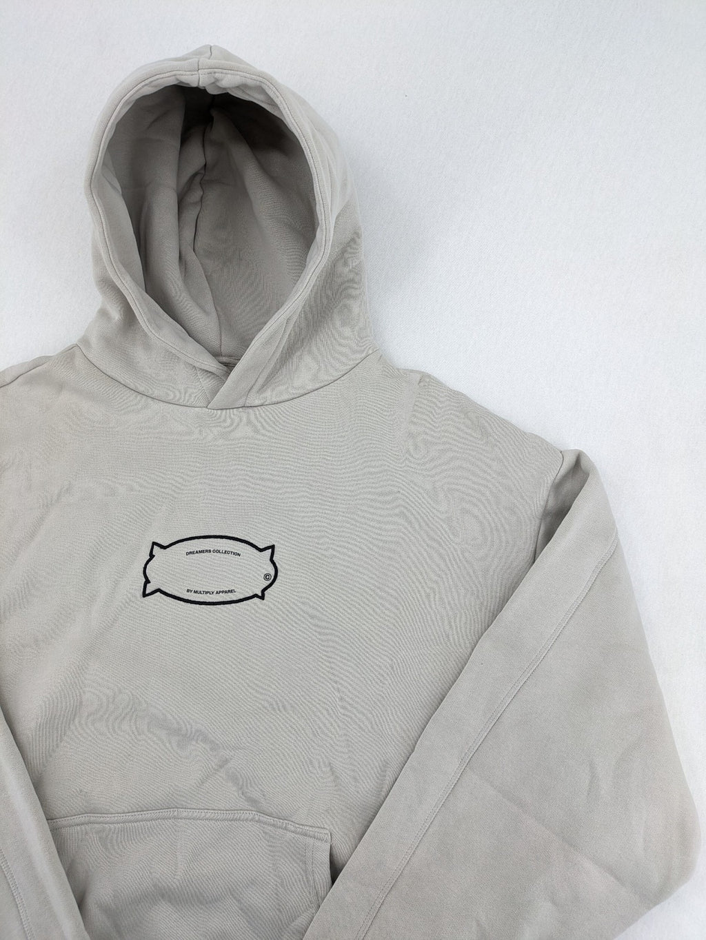 Multiply grey zip-through hoodie with embroidered logo and large "MLTPLY" print on back.