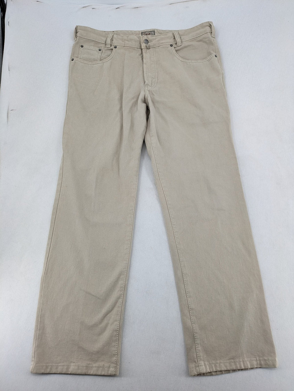 Joker beige straight jeans 5-pocket design with zipper and button closure.