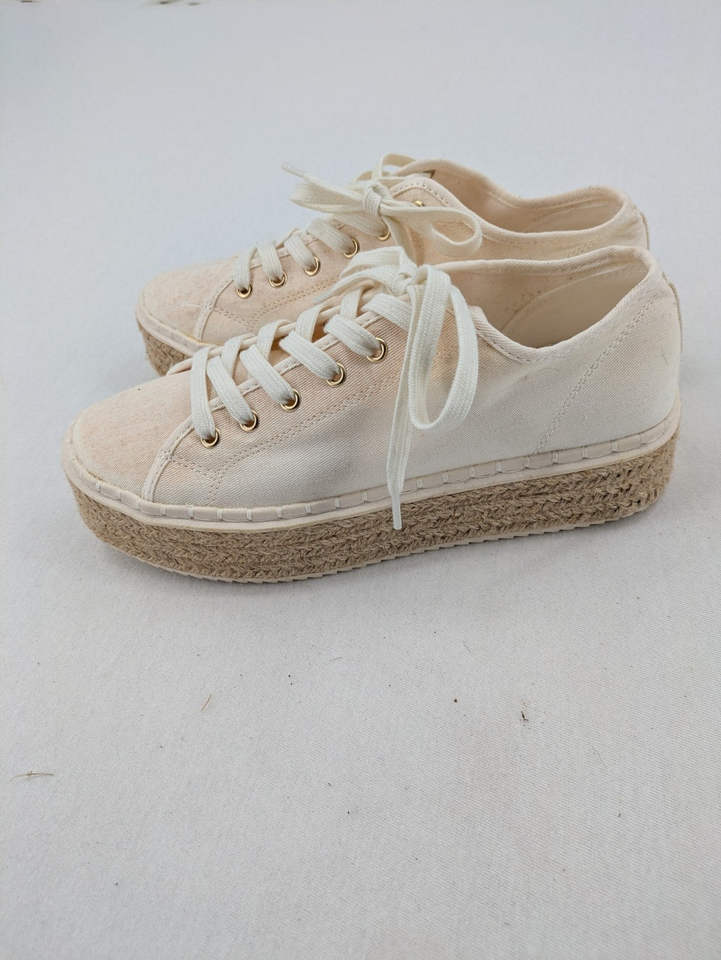 H&M beige espadrille sneakers with jute sole and cream canvas upper.