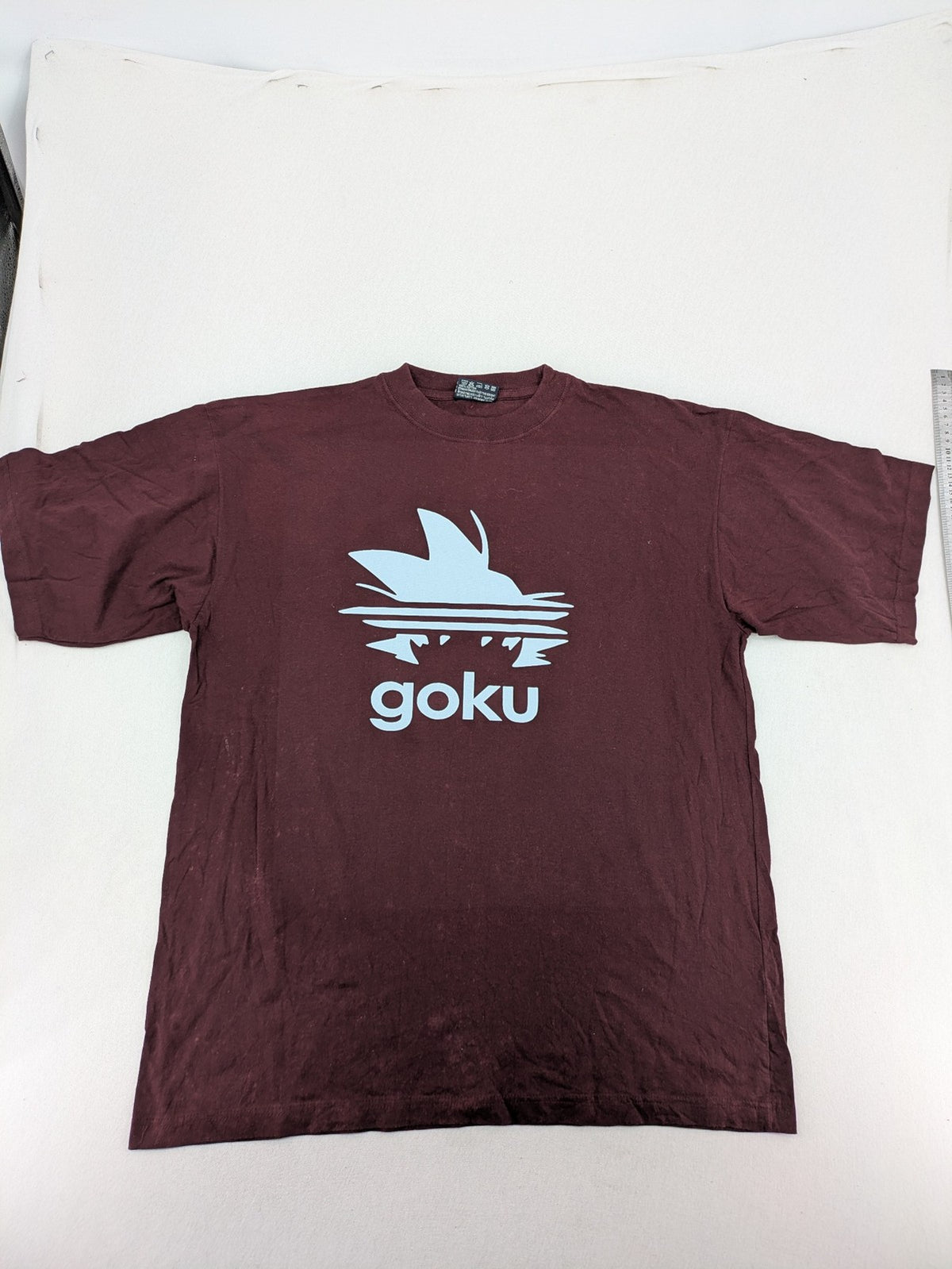 ADI band t-shirt burgundy with blue graphic parody of Adidas logo and Goku silhouette