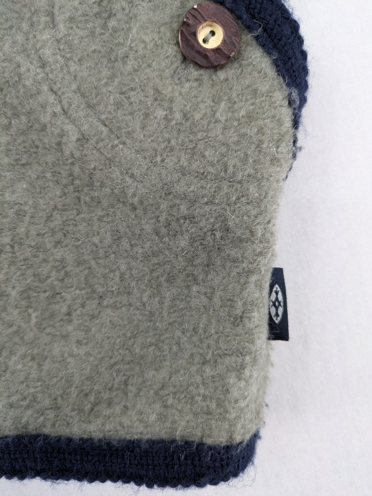 Caramasov grey and navy children's Janker jacket with contrasting trim and rustic buttons.