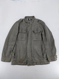 Walbusch khaki military jacket with checkered blue-white lining and multiple pockets.