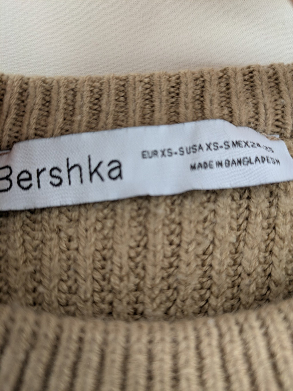 Bershka cream turtle neck jumper with brown and white striped pattern in ribbed knit.
