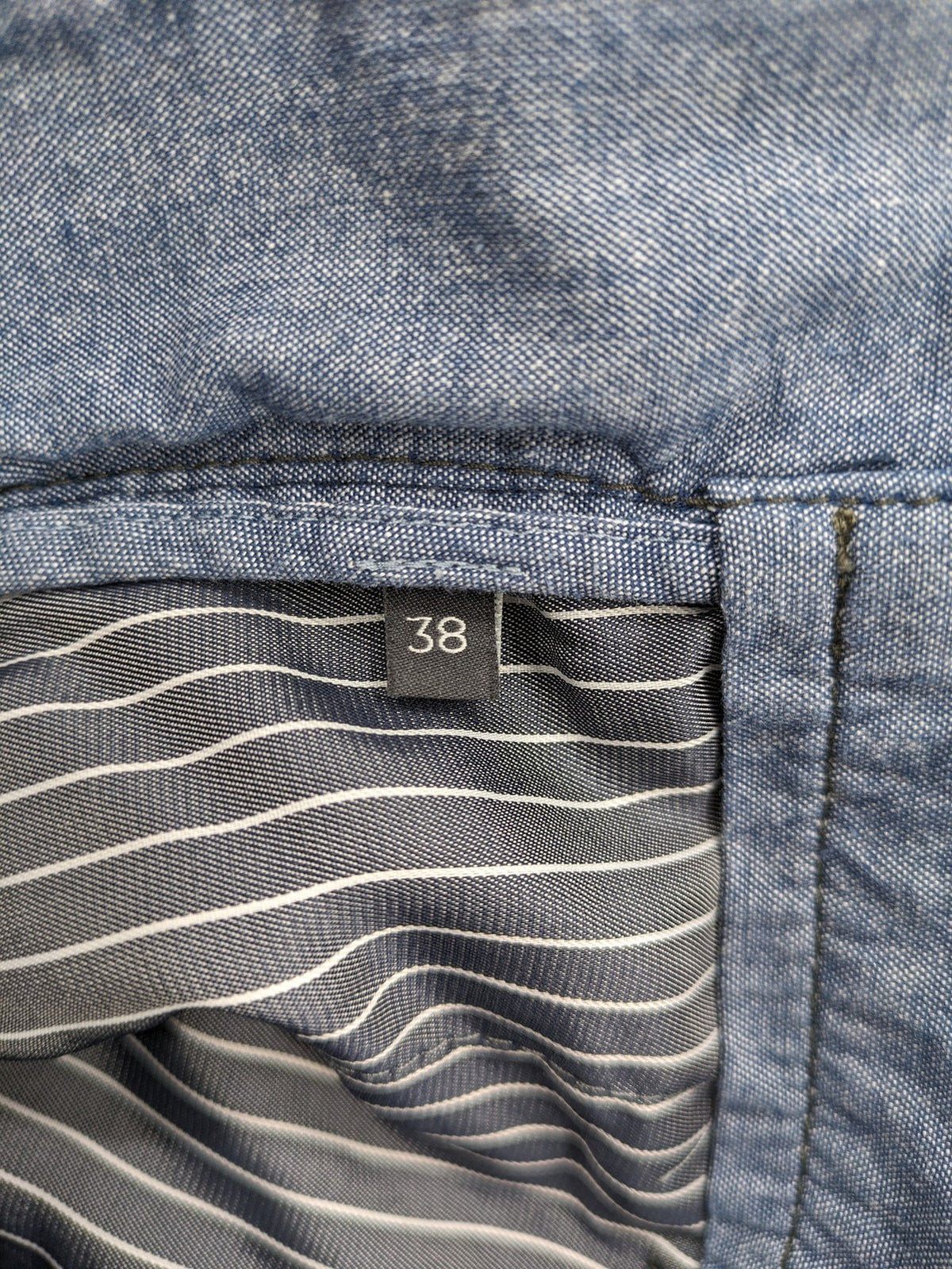 Marc O'Polo blue chino pants with button flap pockets and relaxed fit design.