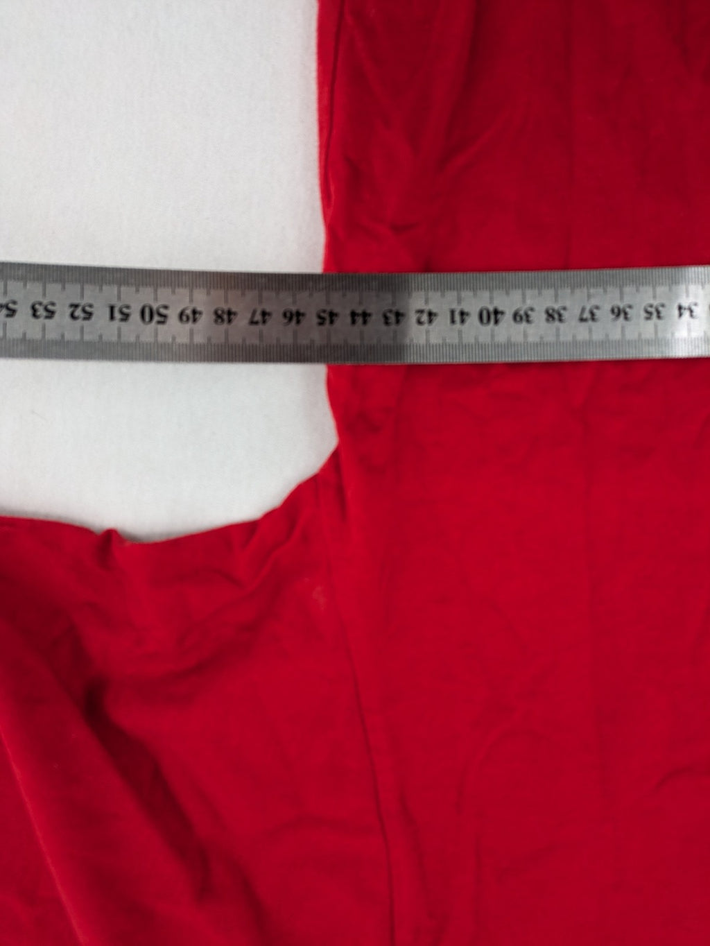 ck red Ringer T-shirt with white collar, "Aufregend.gut" slogan, 100% cotton.