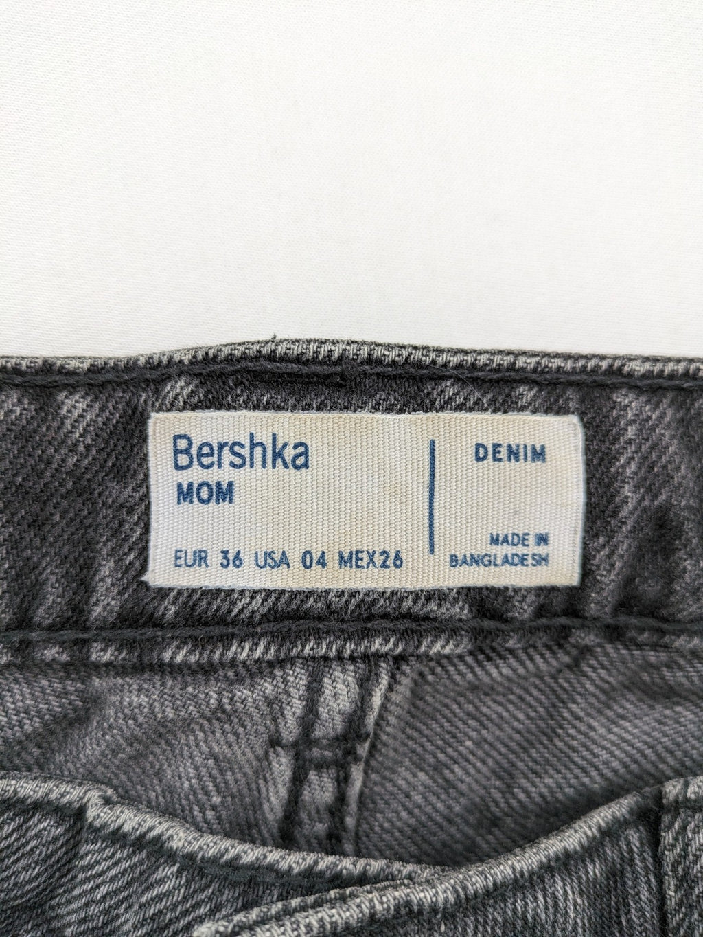 Bershka black mom jeans high-waist straight leg washed denim with classic five-pocket design.