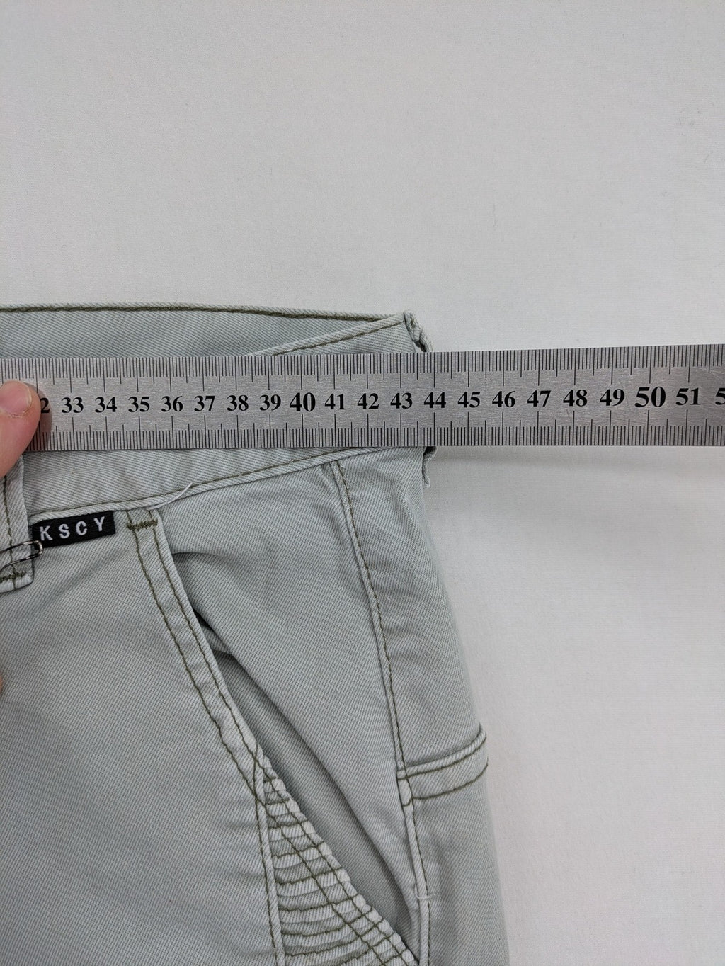 KSCY grey straight jeans with distressed details and ribbed biker inserts.