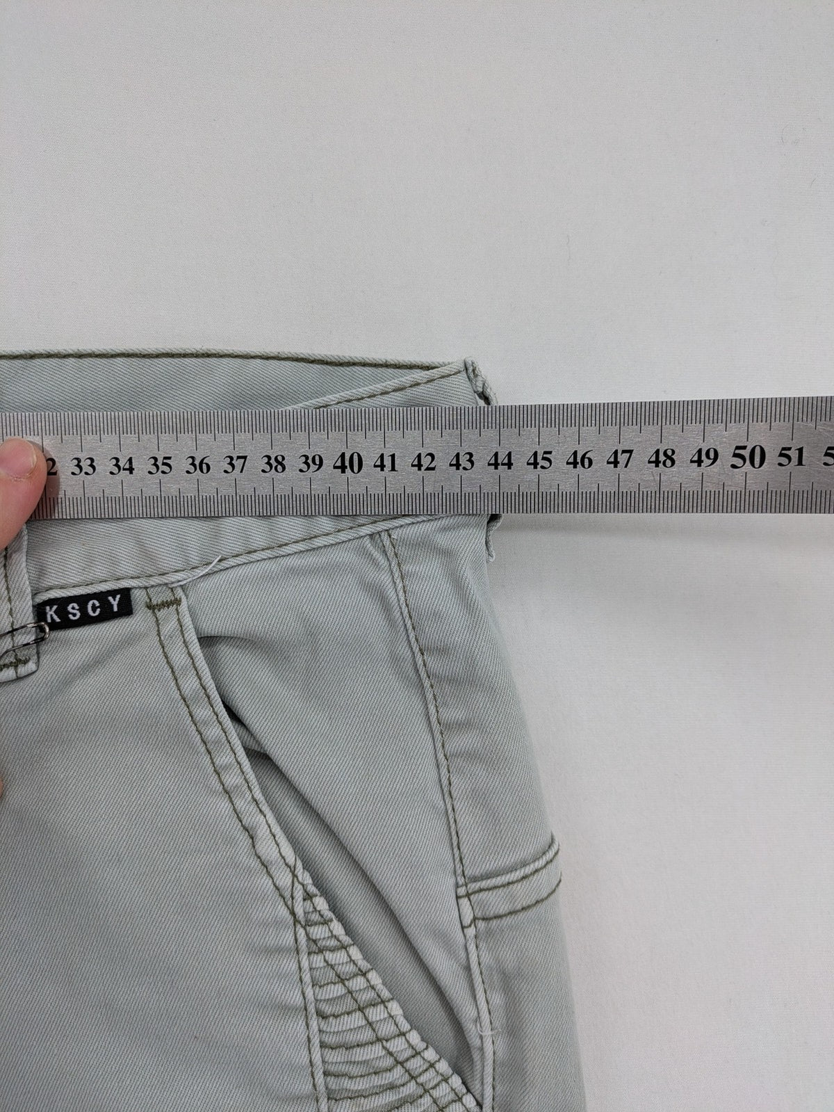 KSCY grey straight jeans with distressed details and ribbed biker inserts.