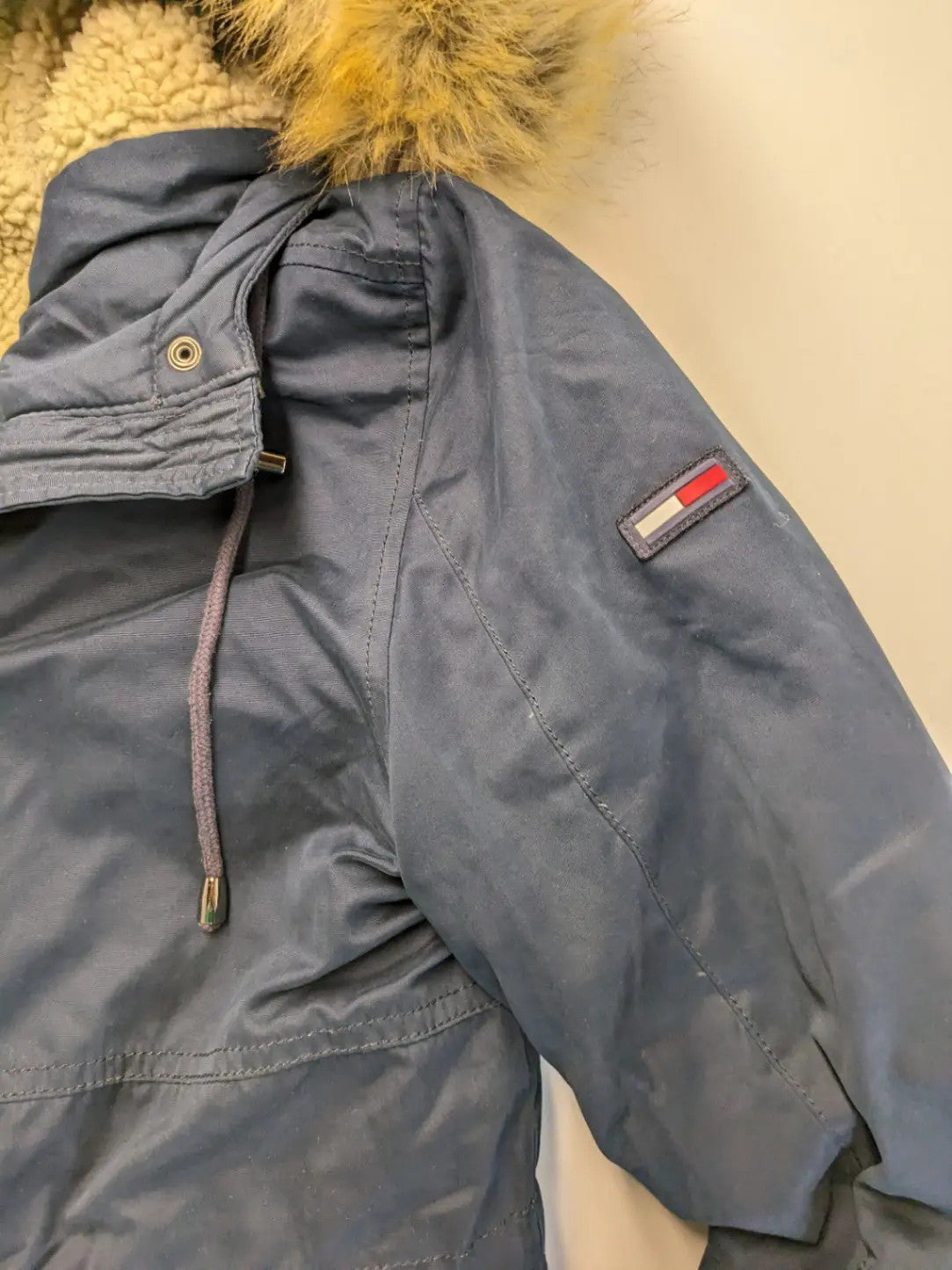 Tommy Hilfiger Denim blue parka coat with faux fur hood and Sherpa lining.