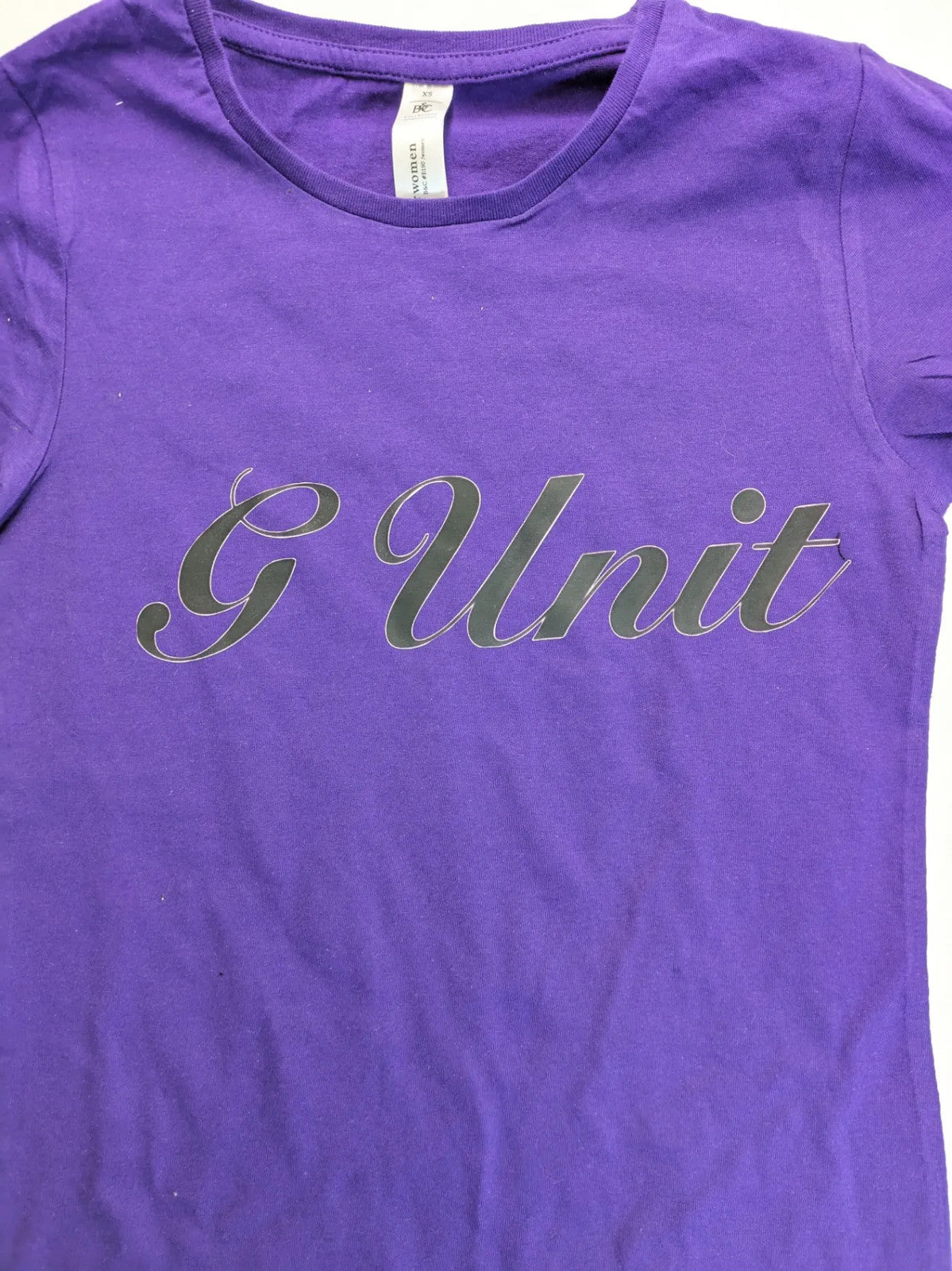 G-Unit gold and purple graphic T-shirt with raised black logo print.