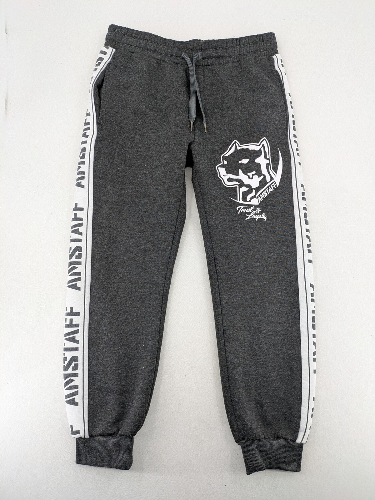 Amstaff grey sweatpants with large dog logo and "Trust & Loyalty" text.