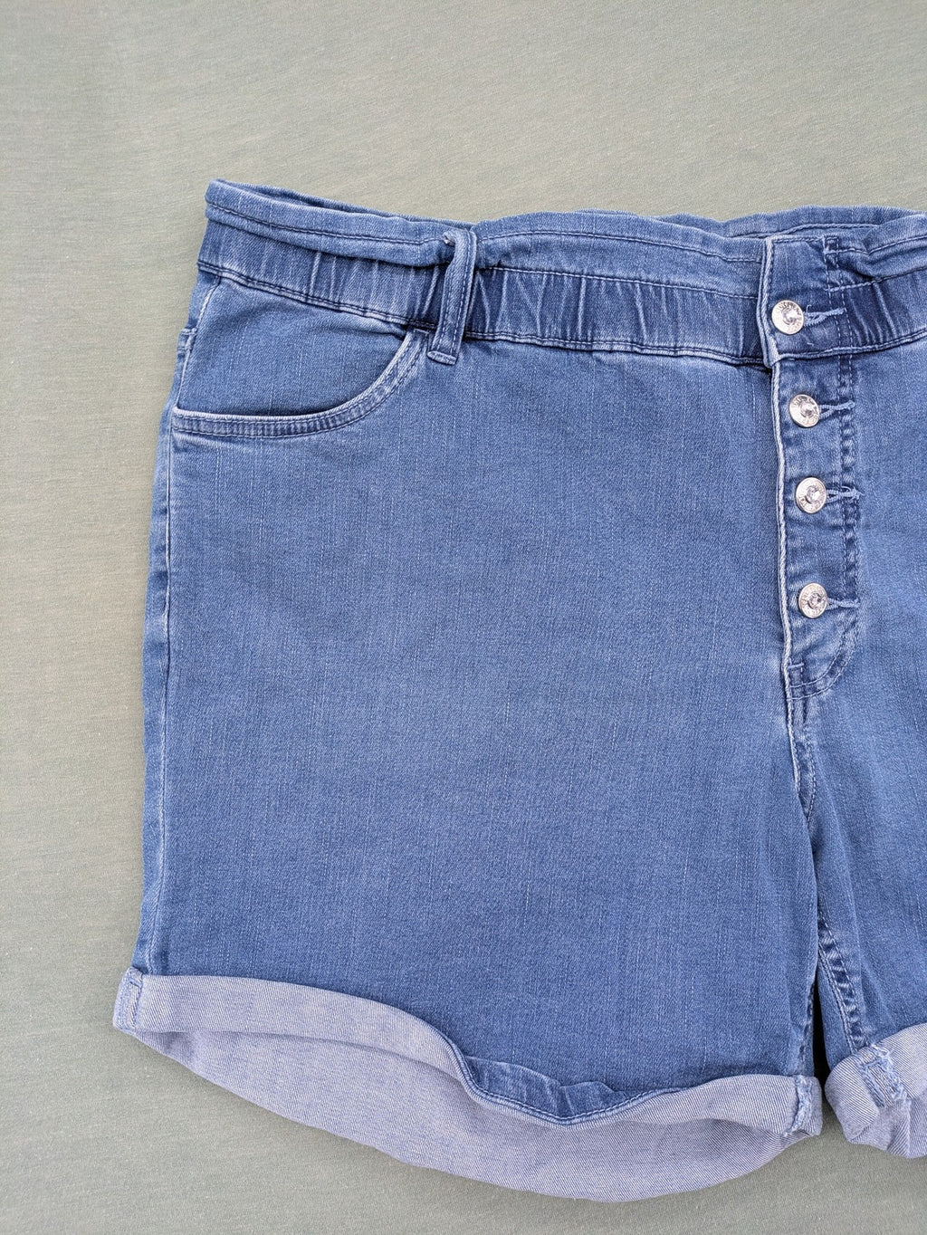Bodyflirt blue high waist paperbag jeans shorts with button fly and rolled cuffs.