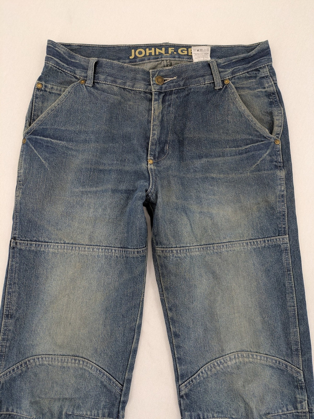 John F. Gee blue straight jeans with reinforced knees and durable denim material.