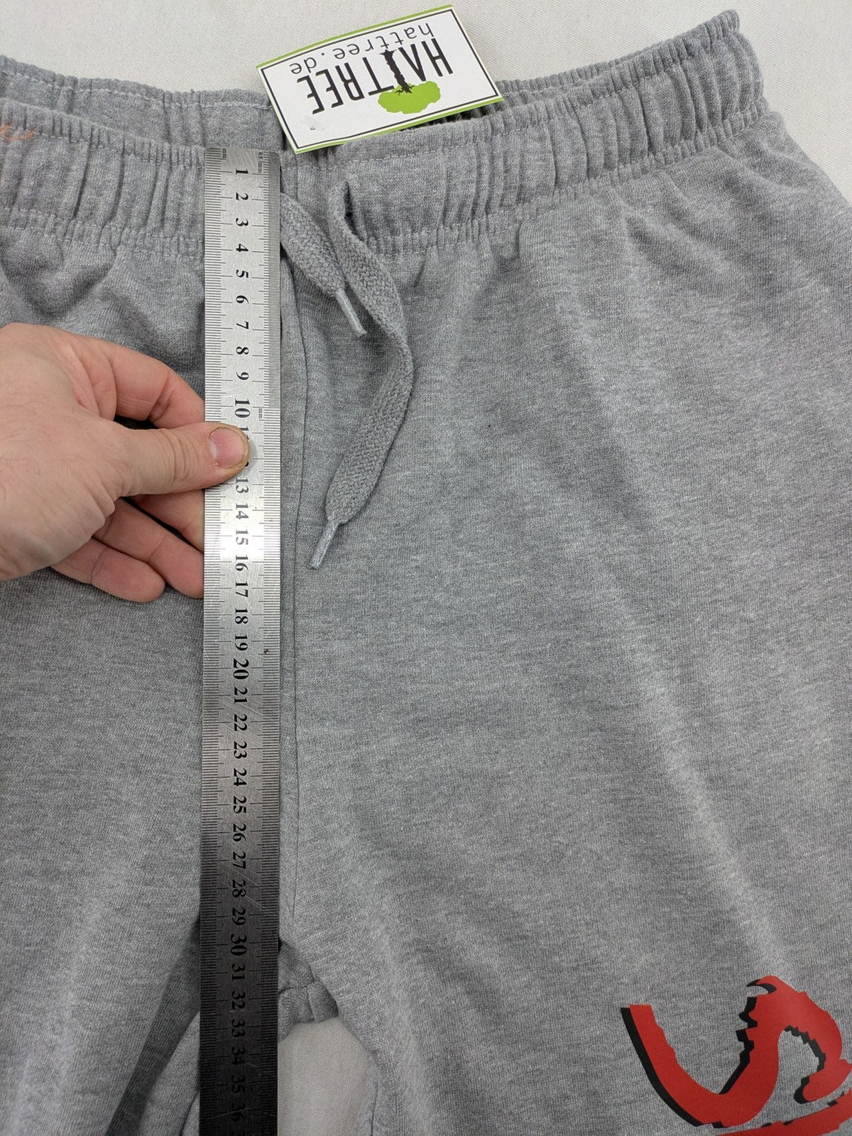 Skid Row grey joggers with red band logo, soft cotton blend, elastic waistband.